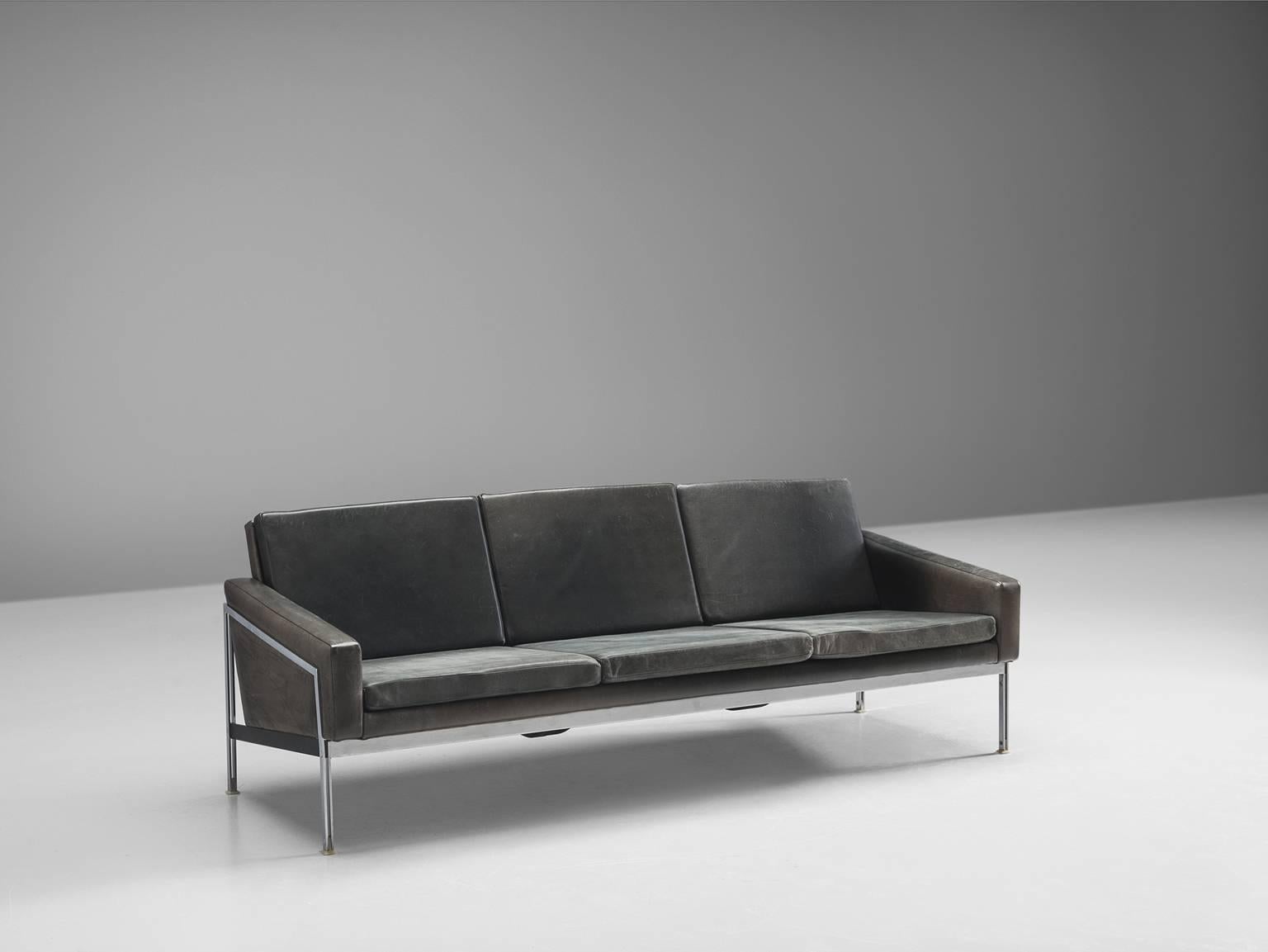 Sofa, three-seat, black leather, steel, Germany, 1950s

This clean and well-constructed three-seat sofa is German in both its aesthetics and construction. This means that is clean, unobstructed and solid. The leather is in great patinated