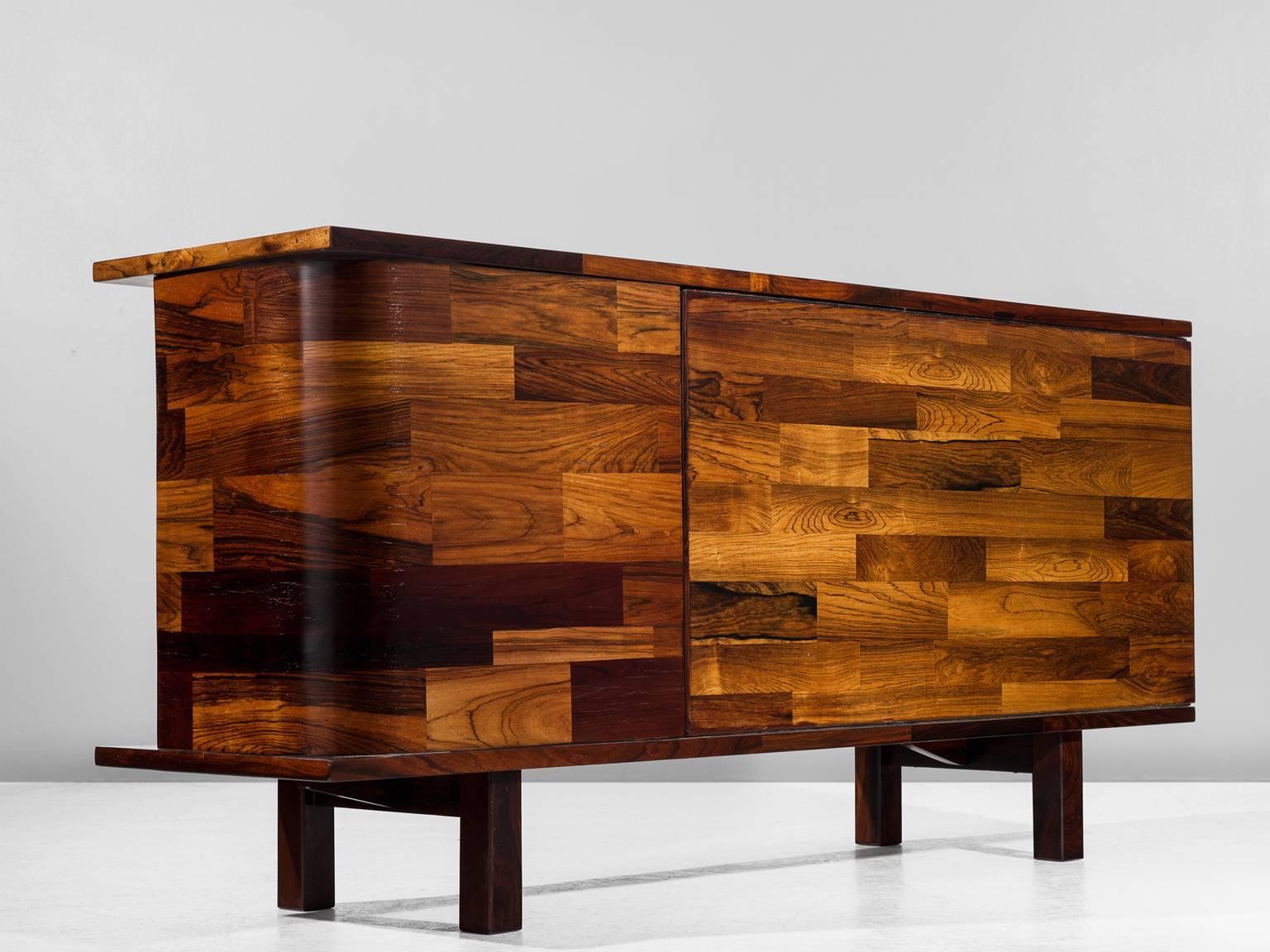 Jorge Zalszupin for L'Atelier, sideboard, rosewood, by Brazil, 1960s.

This wonderful little cabinet is designed by Jorge Zalszupin (1922-) for L'Atelier. Highly detailed inlaid rosewood veneer pieces which create this unique and exceptional