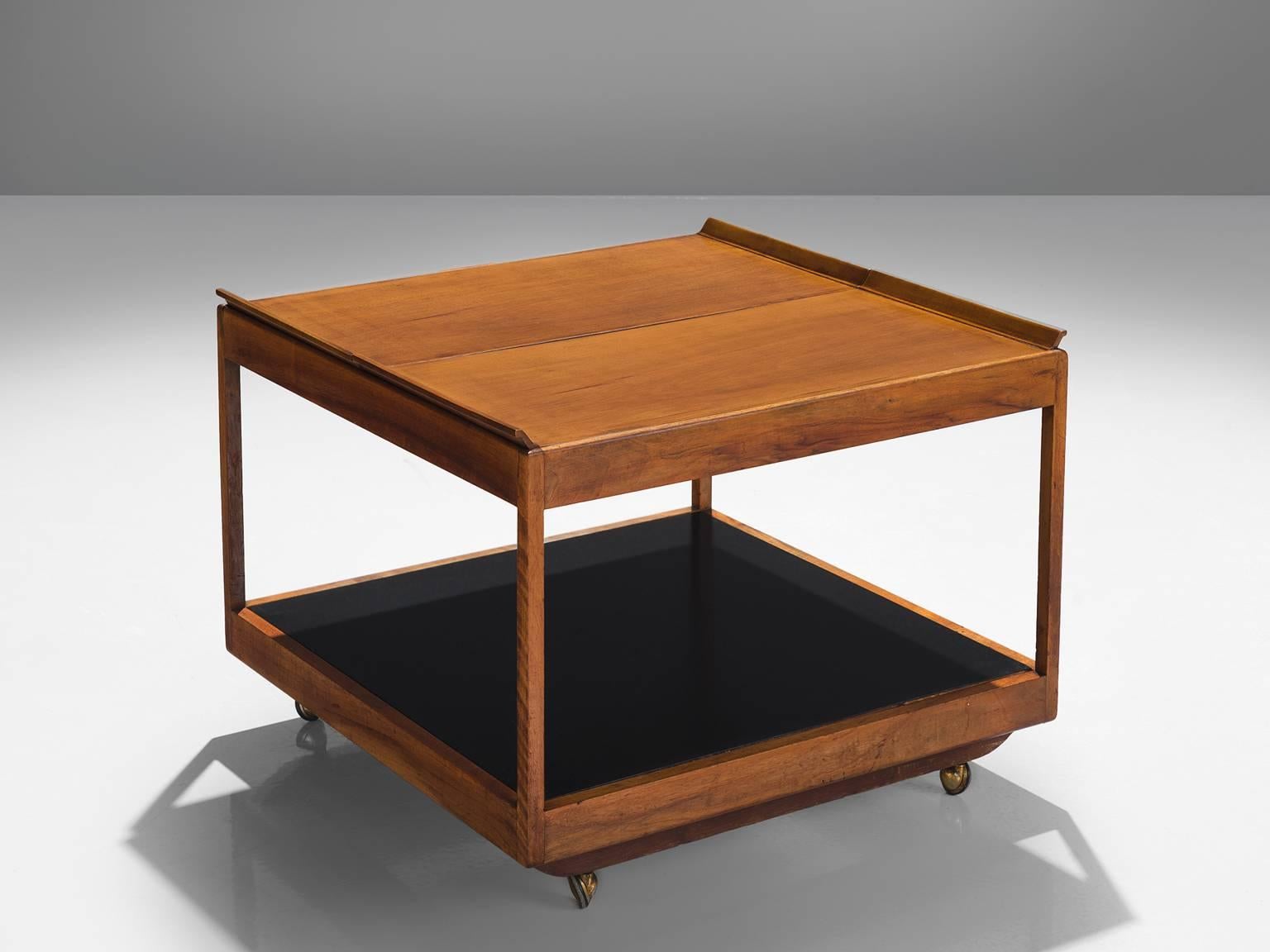Martin Eisler for Forma, 1452 trolley table, stained beech, brassed metal, formica, circa 1960.

This small elegant coffee table and bar trolley is designed by Martin Eisler for Forma. All the separate elements of this table can be adjusted. The