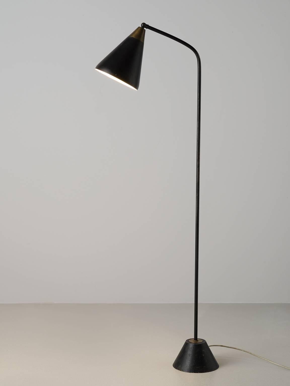 Floor lamp, lacquered metal, brass by Hans Bergström for Ateljé Lyktan, Sweden, 1950s.

This slender floor lamp is designed by the Swede Hans Bergström. The lamp features an adjustable shade with decorative holes in the rim of shade and a