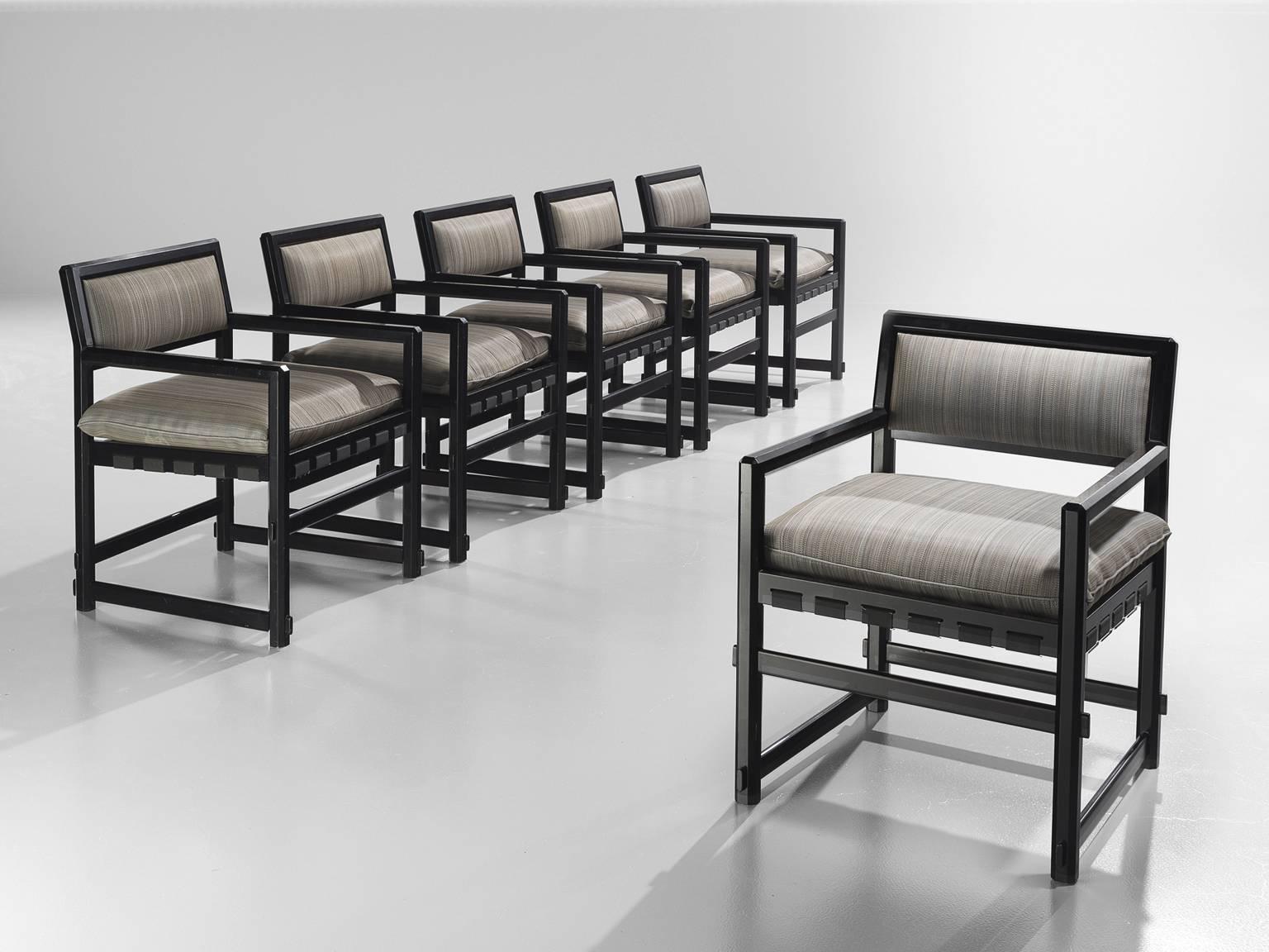 Set of six armchairs, lacquered black wood and fabric, design by Edward Wormely for Dunbar executed by Mobilier Universel, Jules Wabbes, Belgium, 1960s.

This set of six grand armchairs is executed with a rare black lacquered frame and soft