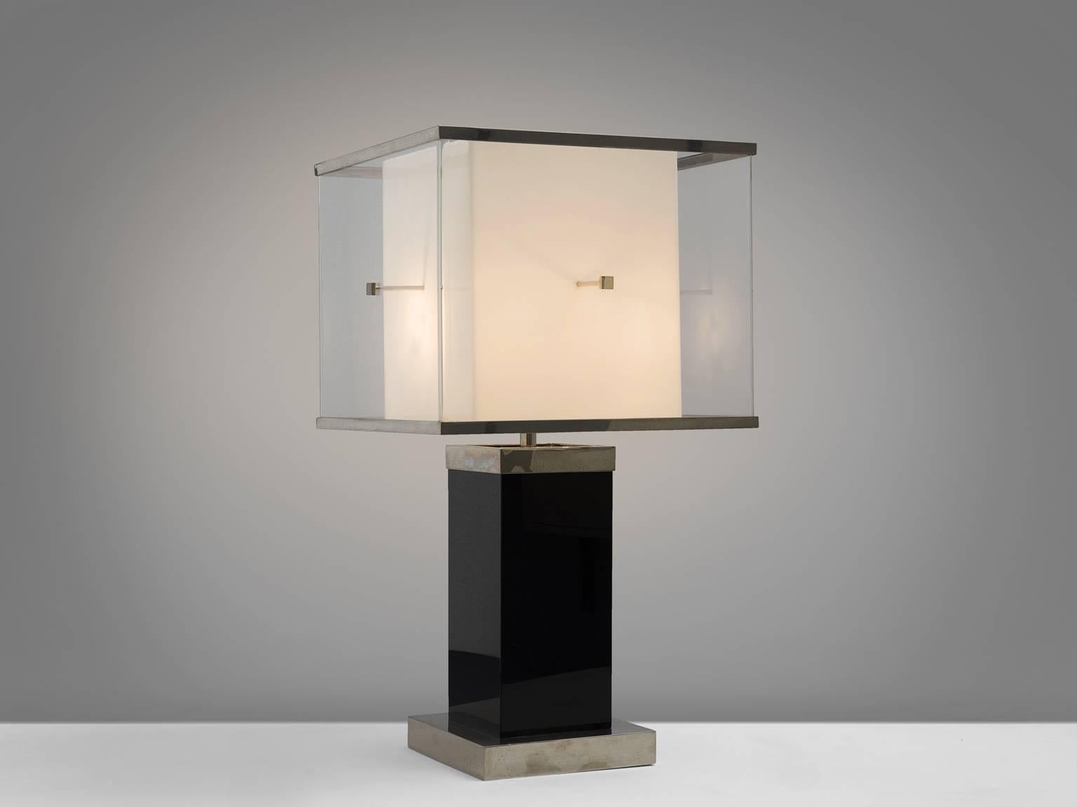 Romeo Rega, floor lamp, Lucite, Italy, 1970s.

This sculptural, cubical floor lamp features a small white base on which a deep black foot rests. On top of the black and white base stands a large shade. The design is typical for postwar, postmodern