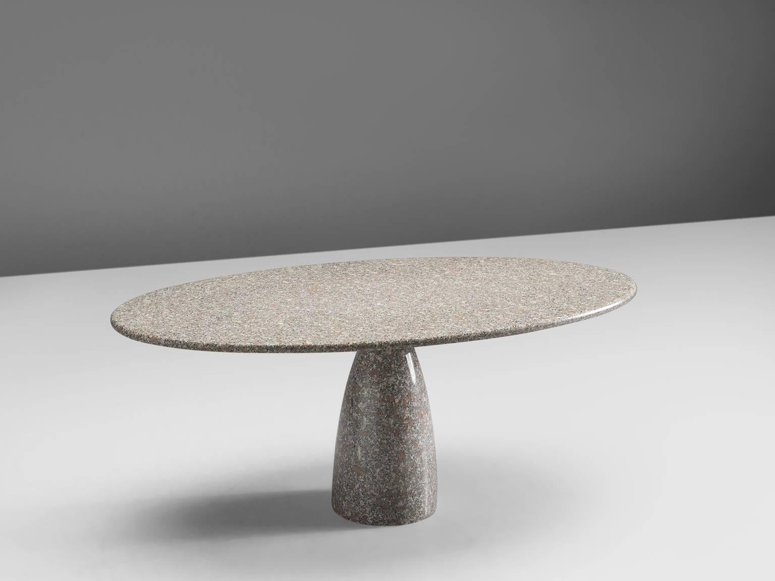 Dining table, granite, Italy, 1970s design, later production.

This oval dining table is executed in the high quality Italian granite with wonderful white, brown and black speckles. The thick tabletop is supported by a colon-shaped single foot