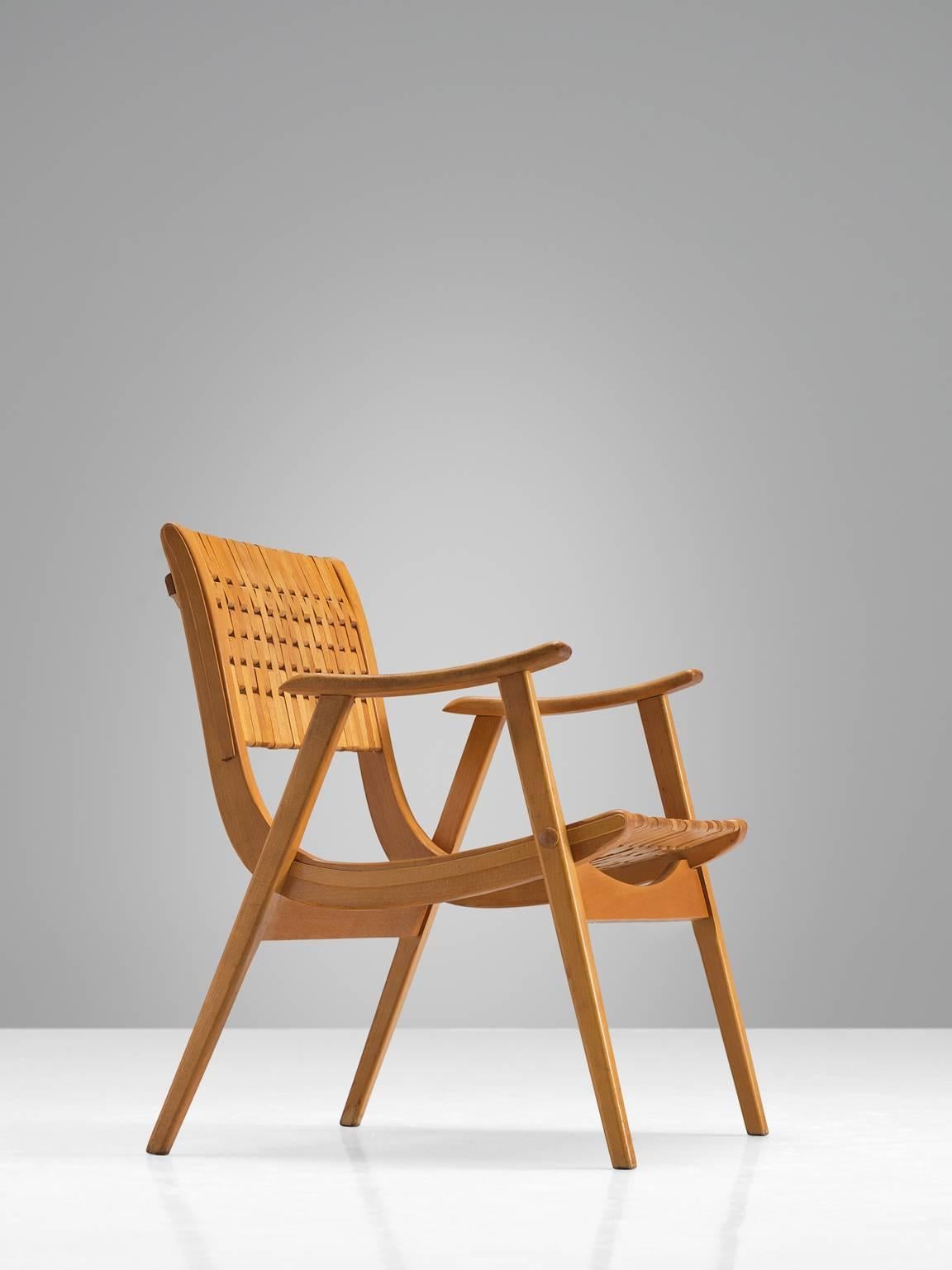 Erich Diekmann for Gelenka Tyskland, bent beech plywood, Germany, circa 1930.

This German chairs is designed by Erich Dieckmann designer who was affiliated to Bauhaus. The chair is executed with typical bent plywood and a webbed back. The style is