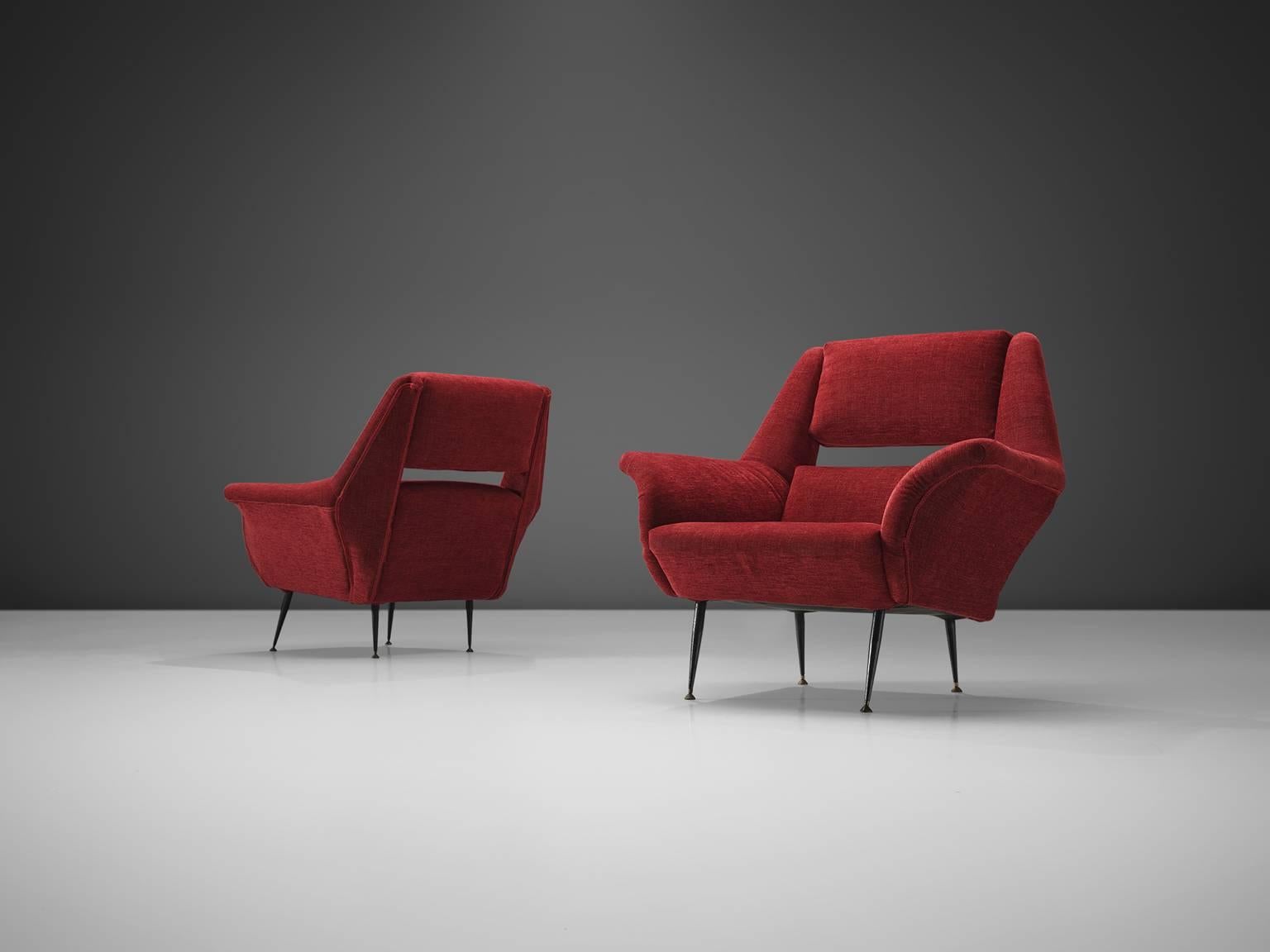 Italian lounge chairs, red fabric, metal legs, brass feet, Italy, 1950s.

These chairs are iconic examples of Italian design from the 1950s. The design is on the one hand simplistic, with elegant, subtle lines. On the other hand the set has a