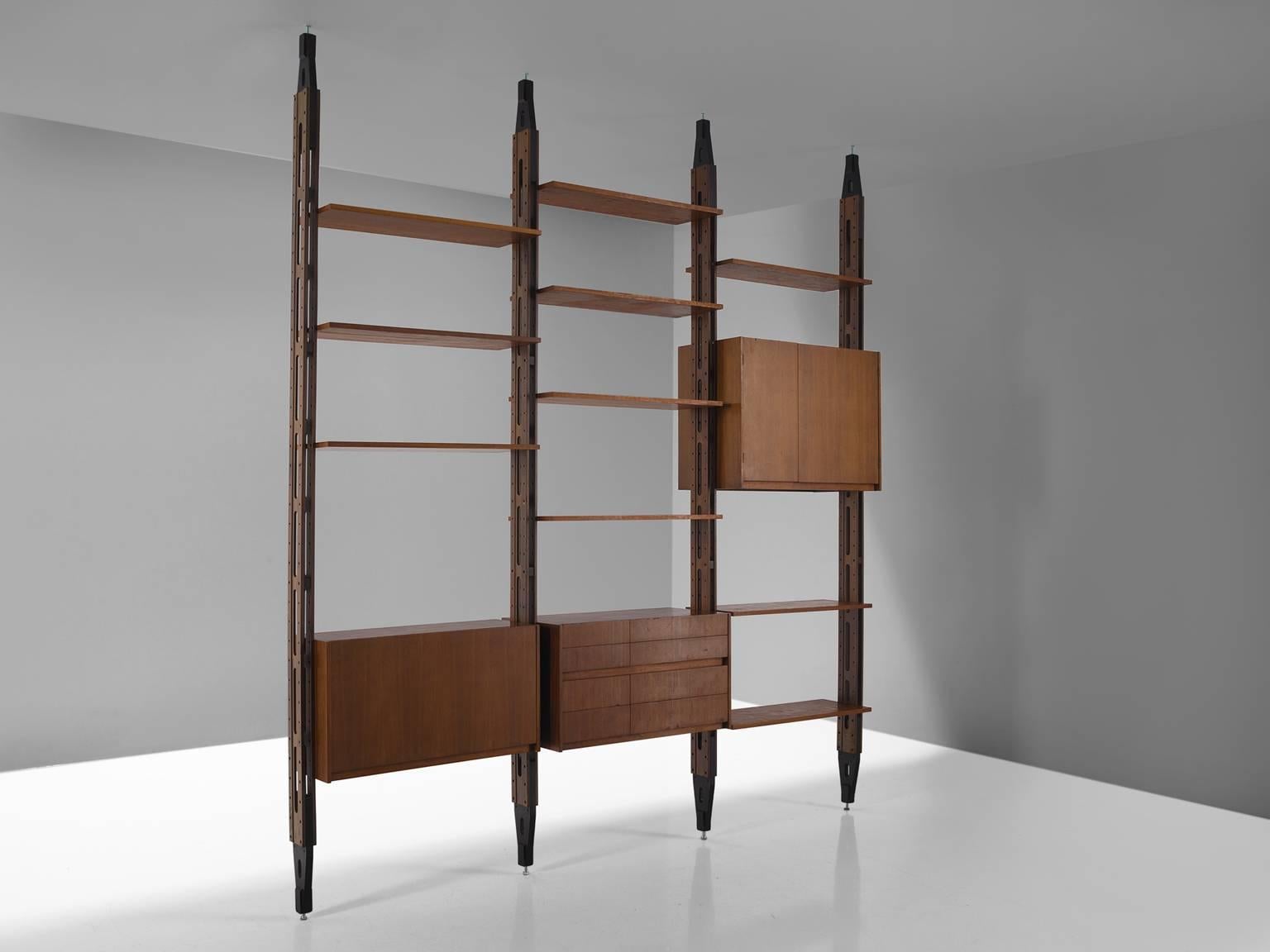 Modular wall unit, walnut, Italy, circa 1960 

The fundamental feature of the furniture designed by Franco Albini and his contemporaries is his way of focussing the attention one the supporting elements. This is clearly visible in this room