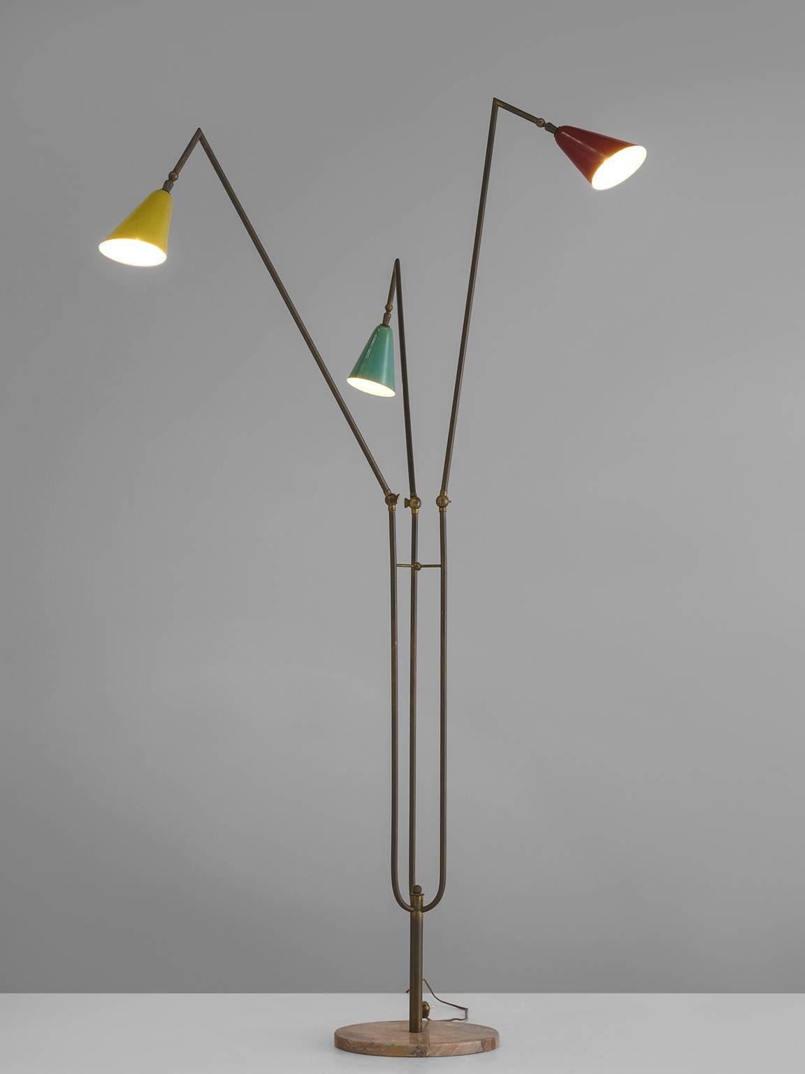 Floor lamp with colored shades in green, yellow and red metal, brass and marble, Italy, 1950s.

This floor lamp is built up of one pedestal pink marble foot from which one brass stem arises that sprout into three arms. The arms each end in a metal