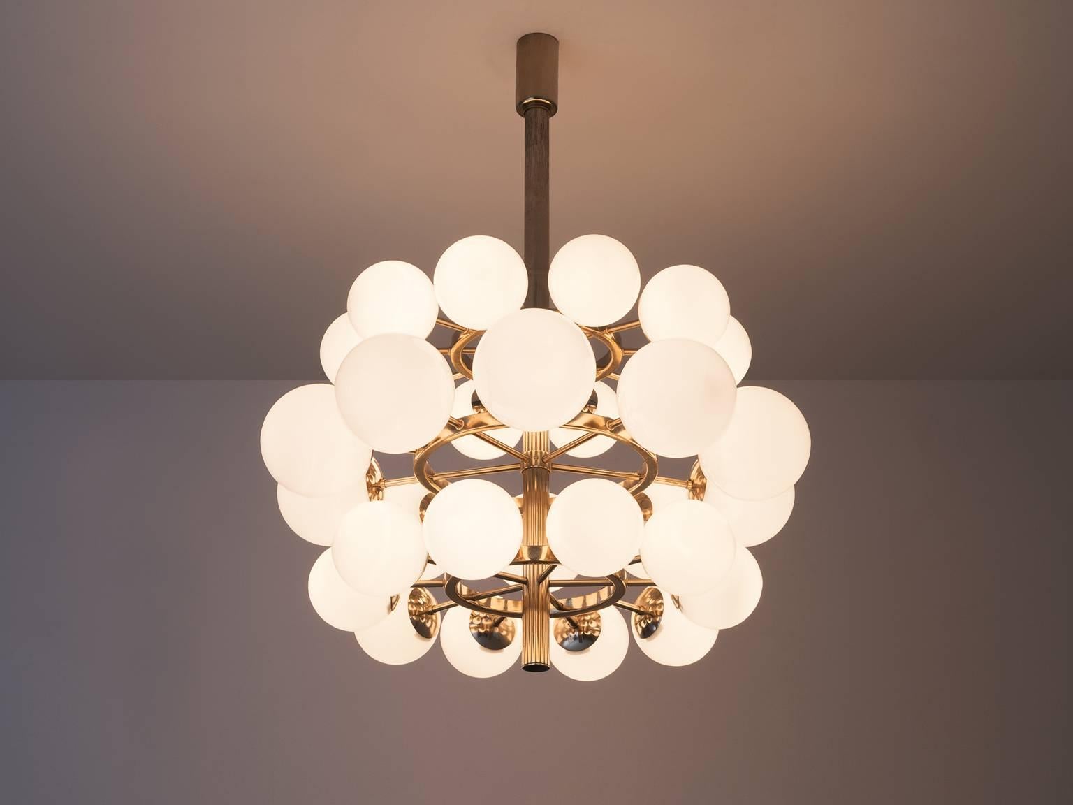 Chandelier, in opaline glass and metal, Europe 1970s. 

Grand chandeliers with opal spheres. The fixture is made of metal with a chrome-brass patina. Therefore an interesting color is visible on the metal. The opaline glass globes are placed over