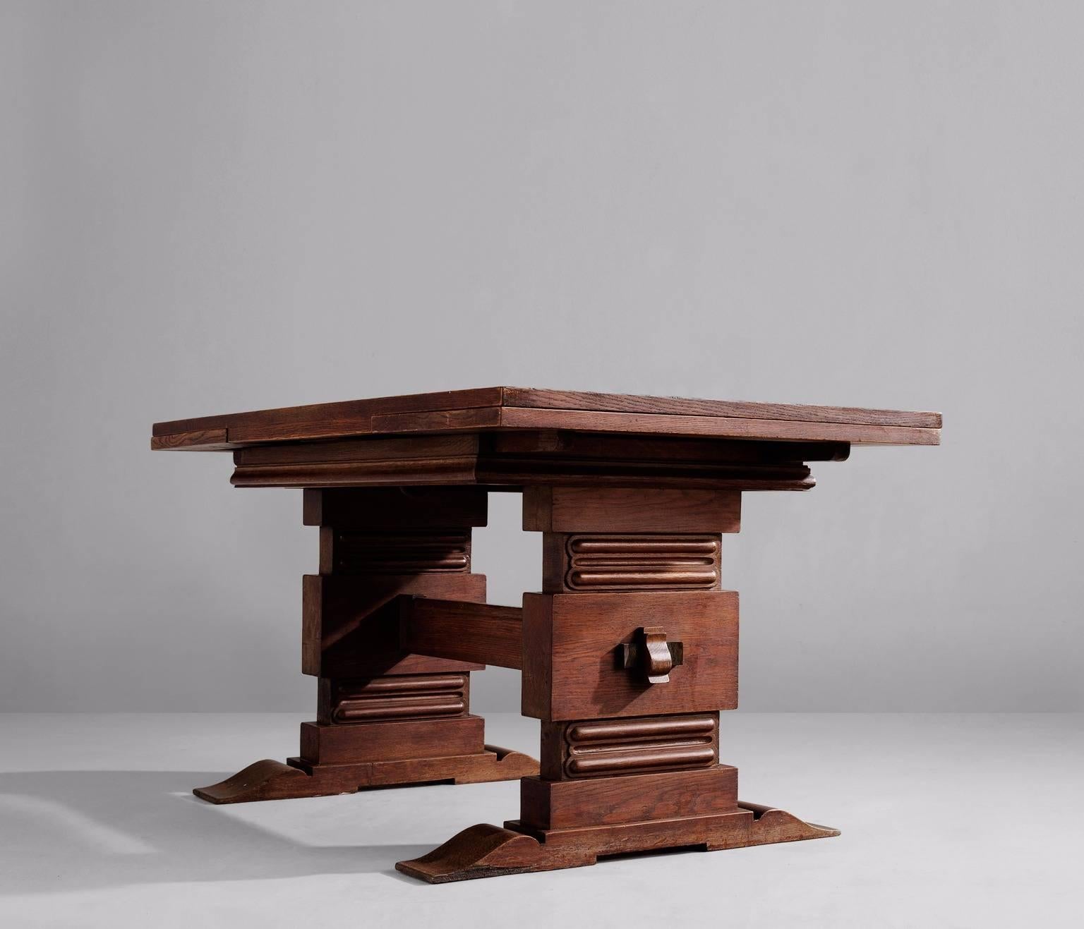 Charles Dudouyt, table, oak and bronze, France, 1930s. 

Dining table with extendable leaves. This high quality table has a wonderful top in parquet technique. The solid bases are decorated in art-deco style with a nice bronze detail. This table