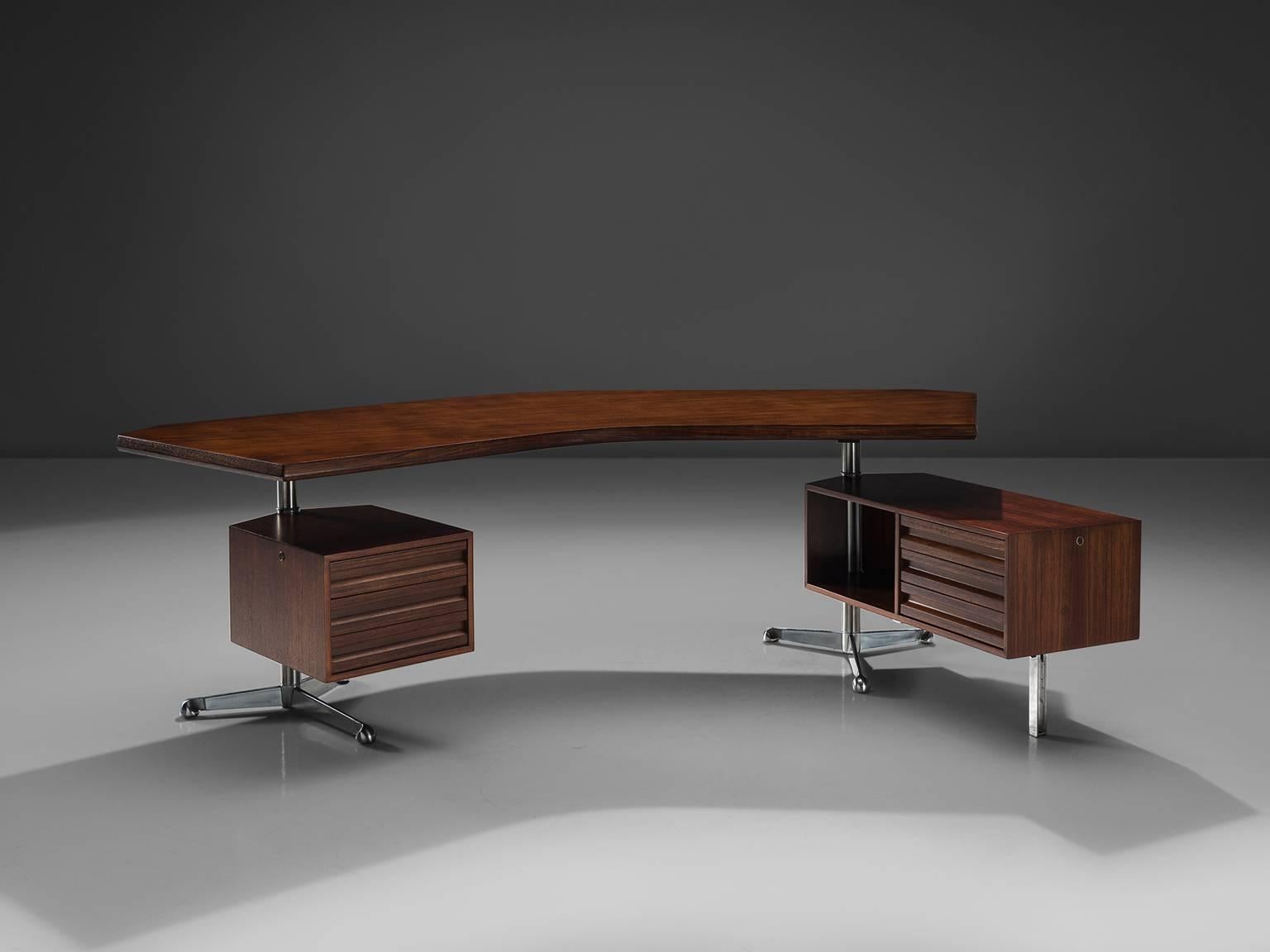 Osvaldo Borsani for Tecno, desk T-96 'Boomerang', rosewood, metal, Italy, 1956. 

This boomerang shaped desk is designed by Osvaldo Borsani. The design consists of a curved top with two revolving cabinets that are held in place by the