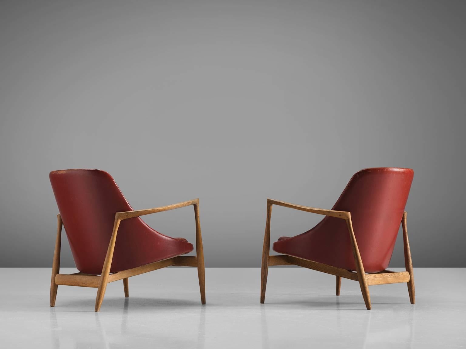 Two lounge chairs, model U-56 'Elizabeth', in oak and leather, by Ib Kofod-Larsen, Denmark, 1956. 

These are two of Kofod-Larsen highest-quality armchairs, with an oak frame and beautiful details in the design. The leather holds beautiful