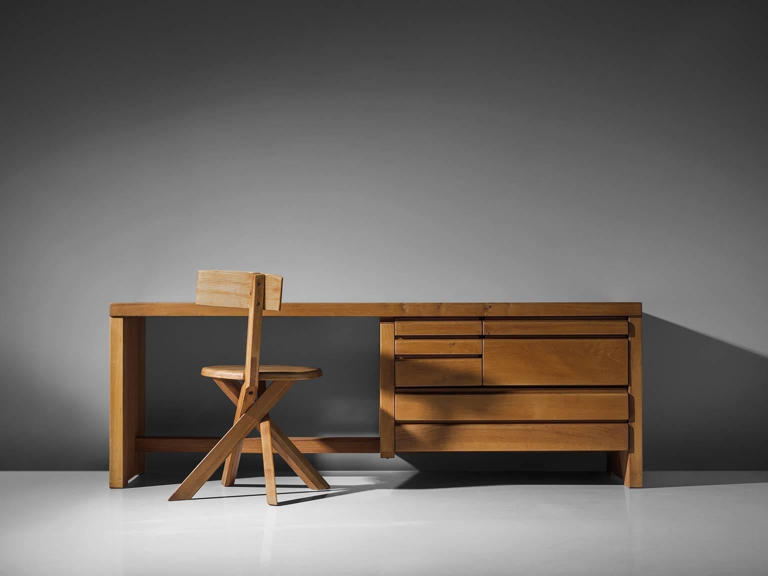 Pierre Chapo, dressing table R05A, elm, circa 1960.

This exquisitely crafted credenza combines a simplified yet complex design combined with nifty, solid construction details that characterize Chapo's work. The dressing table has seven drawers.