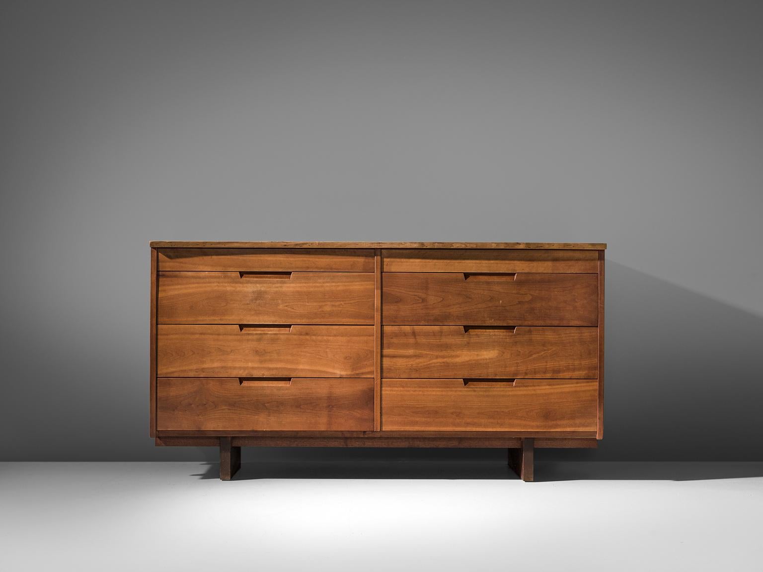George Nakashima, cabinet in walnut, New Hope, PA, 1960s-1970s.

This cabinet features eight drawers, executed in walnut with traditional and finished with archetypical dovetail Nakashima wood-joints. The cabinet rests on two slabs of solid walnut