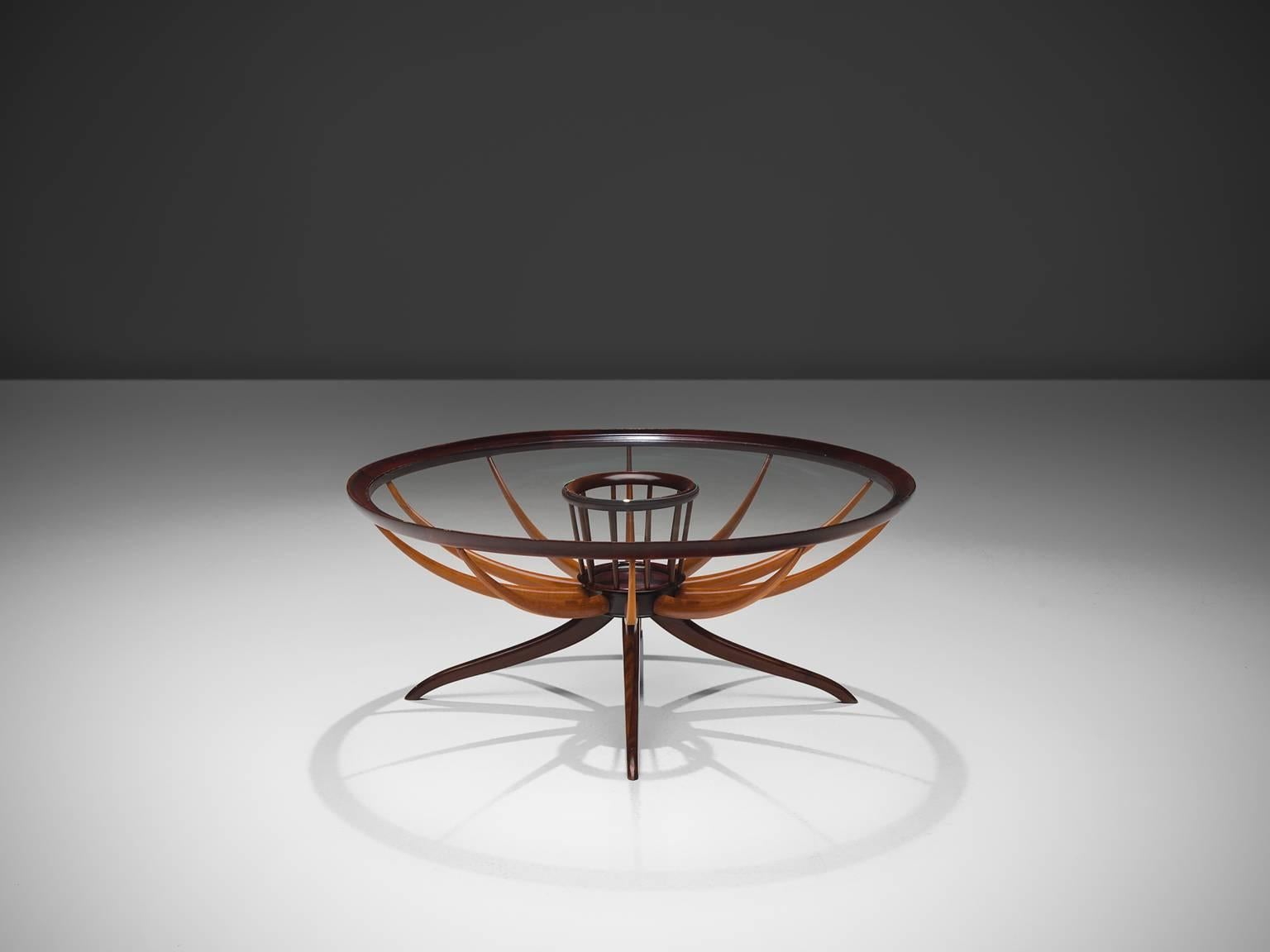 Giuseppi Scapinelli, side table, caviuana and glass, Italy, 1950s.

This delicate round side table is designed by the Brazilian designer Scapinelli. The table features delicate organic wooden 'beams' that flow from the middle towards the bottom