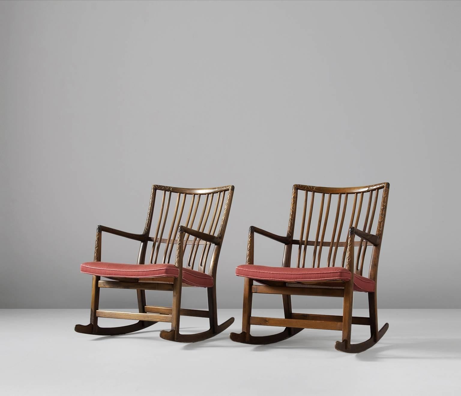 Set of two beech rocking chairs by Hans Wegner, model ML-33, Denmark 1940s. 

These rocking chairs are an early design of Hans Wegner, produced by master-carver and cabinetmaker Mikael Laursen. Model ML-33 is know as the first rocking chair by