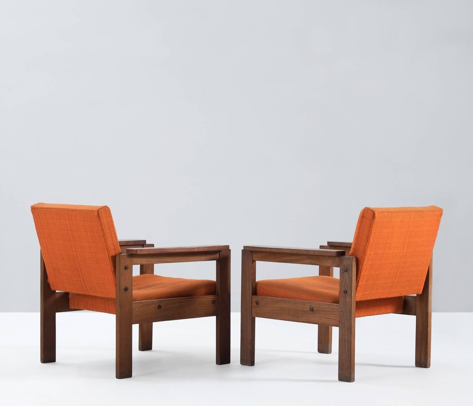 Pair of armchairs, in mahogany and fabric, France, 1950s.

These simplistic designed chairs have an interesting frame with straight lines and a sincere construction. The solid mahogany frame is sturdy and well made. Due their construction and
