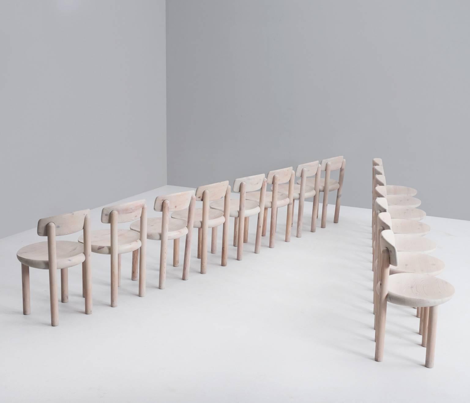 Set of nine dining chairs in solid pine wood, with a white wash finish, Denmark 1970s.

This chair is very well made, with basic construction and solid legs, seat and back which gives the chair a strong expression. 

This basic shaped design has an