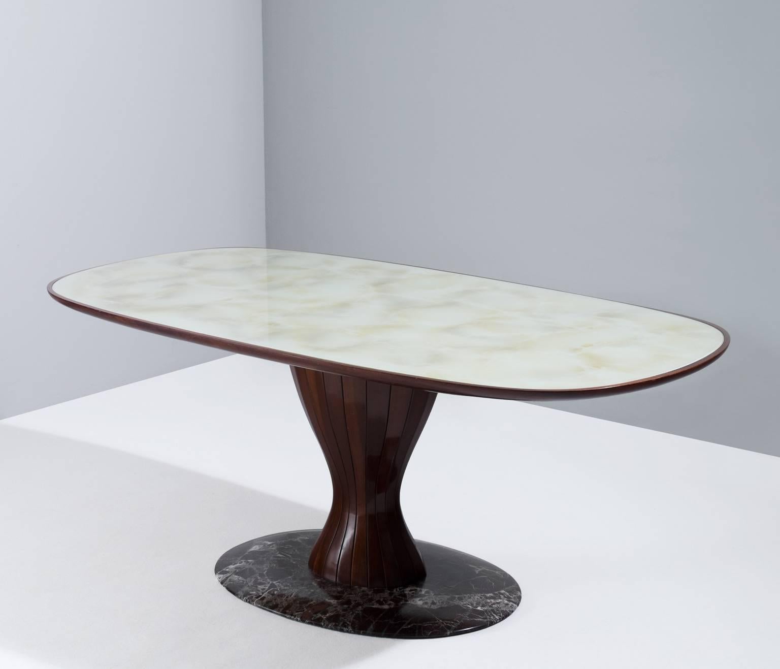 Center table, in wood and glass, Italy 1950s.

Wonderful Italian pedestal table in wood and painted marble look, finished with a glass top.
In the manner of early Osvaldo Borsani, Italy 1950s.

The dark stained wooden base shows magnificent
