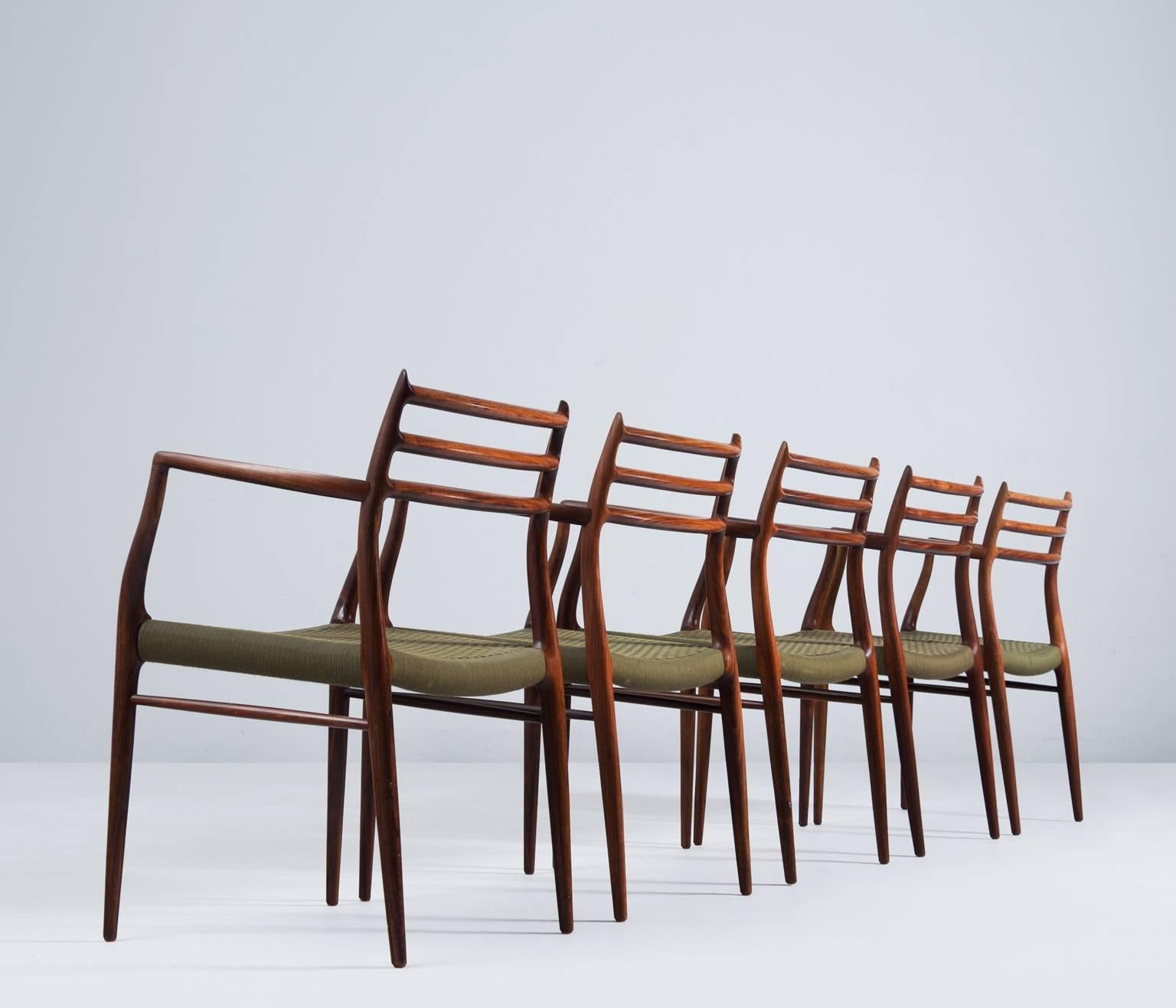 Set of five armchairs designed by Niels O. Møller, for J.L. Møllers Møbelfabrik, Denmark 1960s.

This design, 'model nr. 62', is by far one of Moller's most refined designs, rewarded worldwide. Combined in rosewood makes this a very rare and