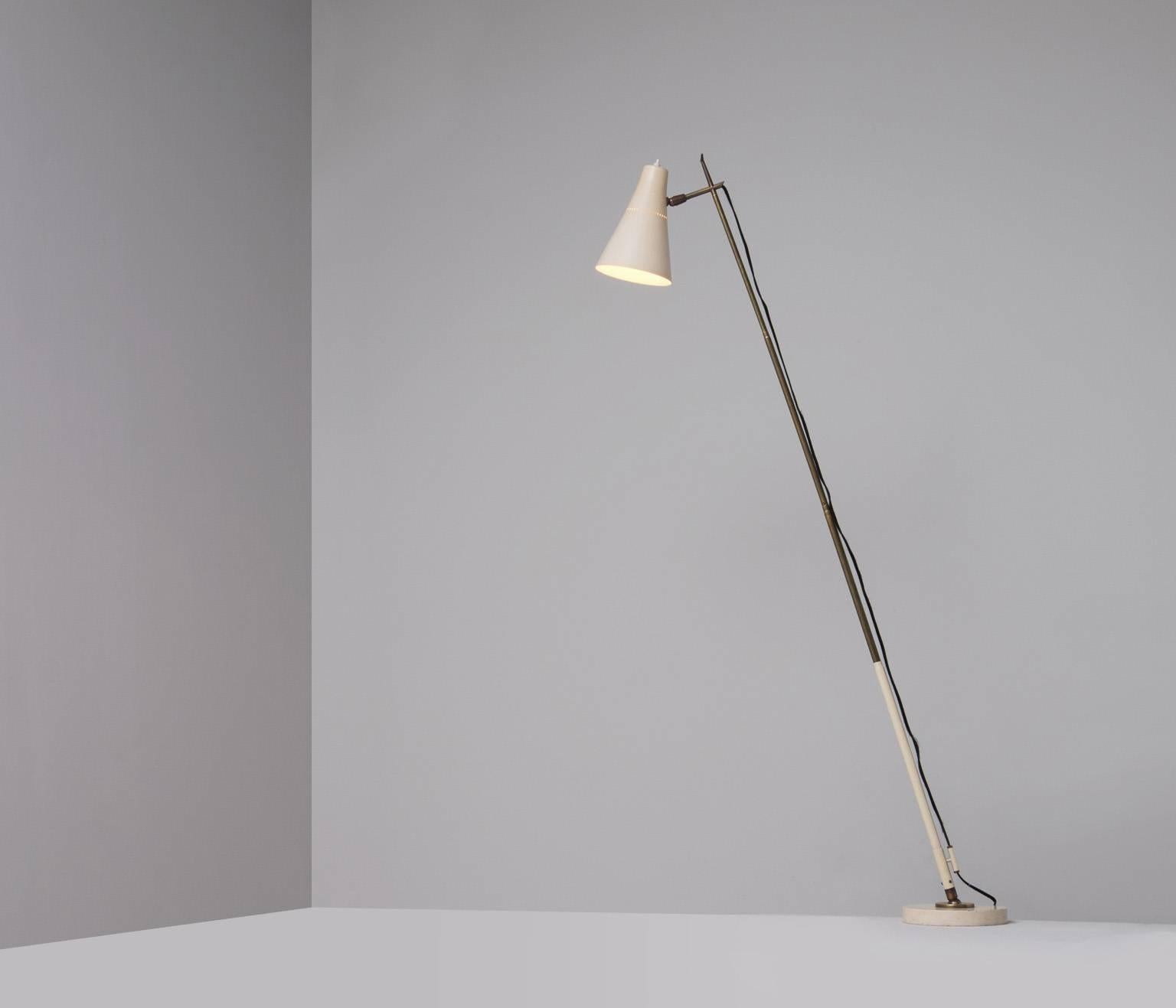Rare adjustable table / floor lamp - model 201 - designed by Giuseppe Ostuni for O-Luce. Unique telescopic arm made of brass allows the lamp to be used either as a table lamp or floor lamp. 

The round base matches perfectly with the painted metal