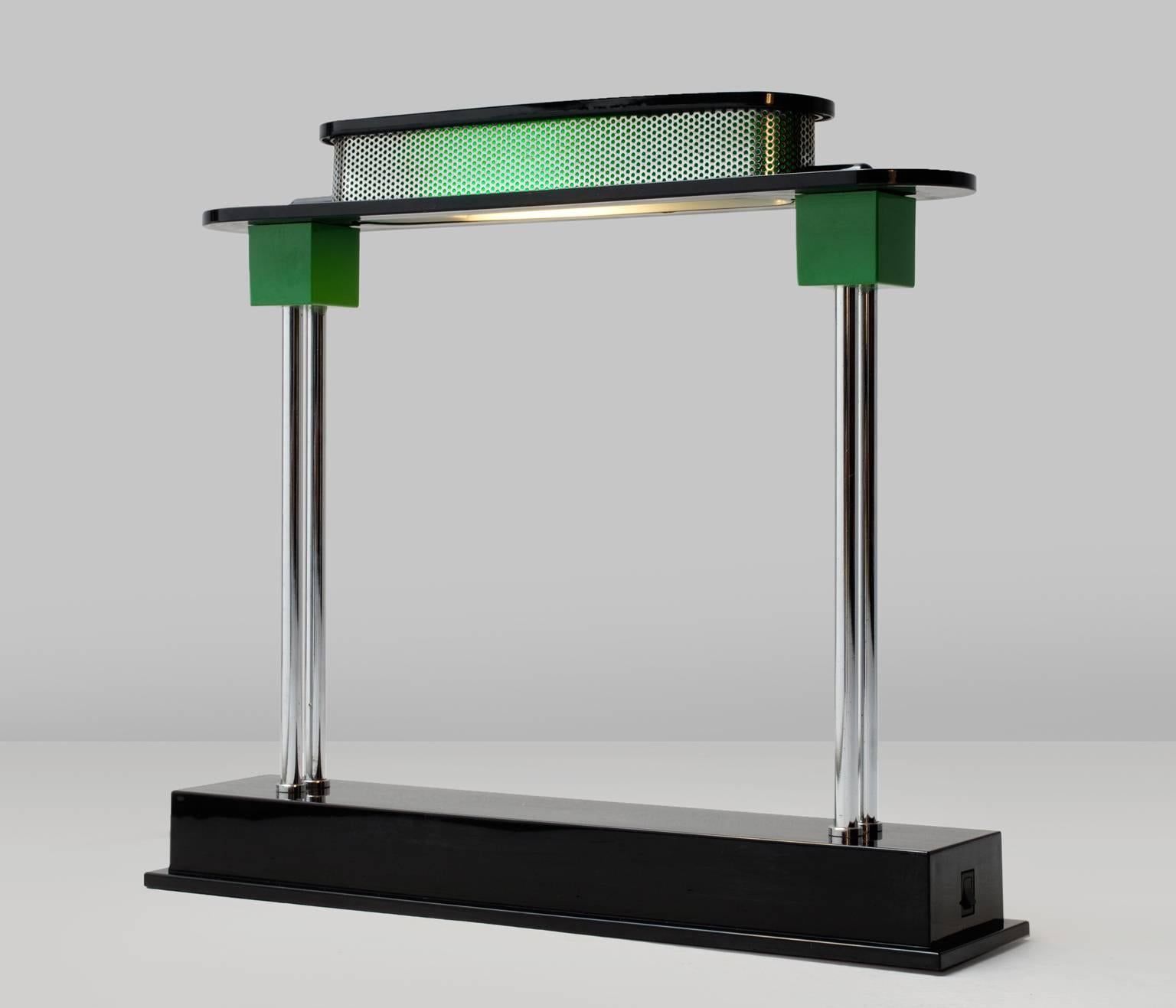 Iconic 'Pausania' desk or table lamp designed by Ettore Sottsass for Artemide, 1982 Italy.

A theatrical item, construction made of chromed tubular steel, black and green plastic. Remarkable are the influence of architecture and the unusual mix of