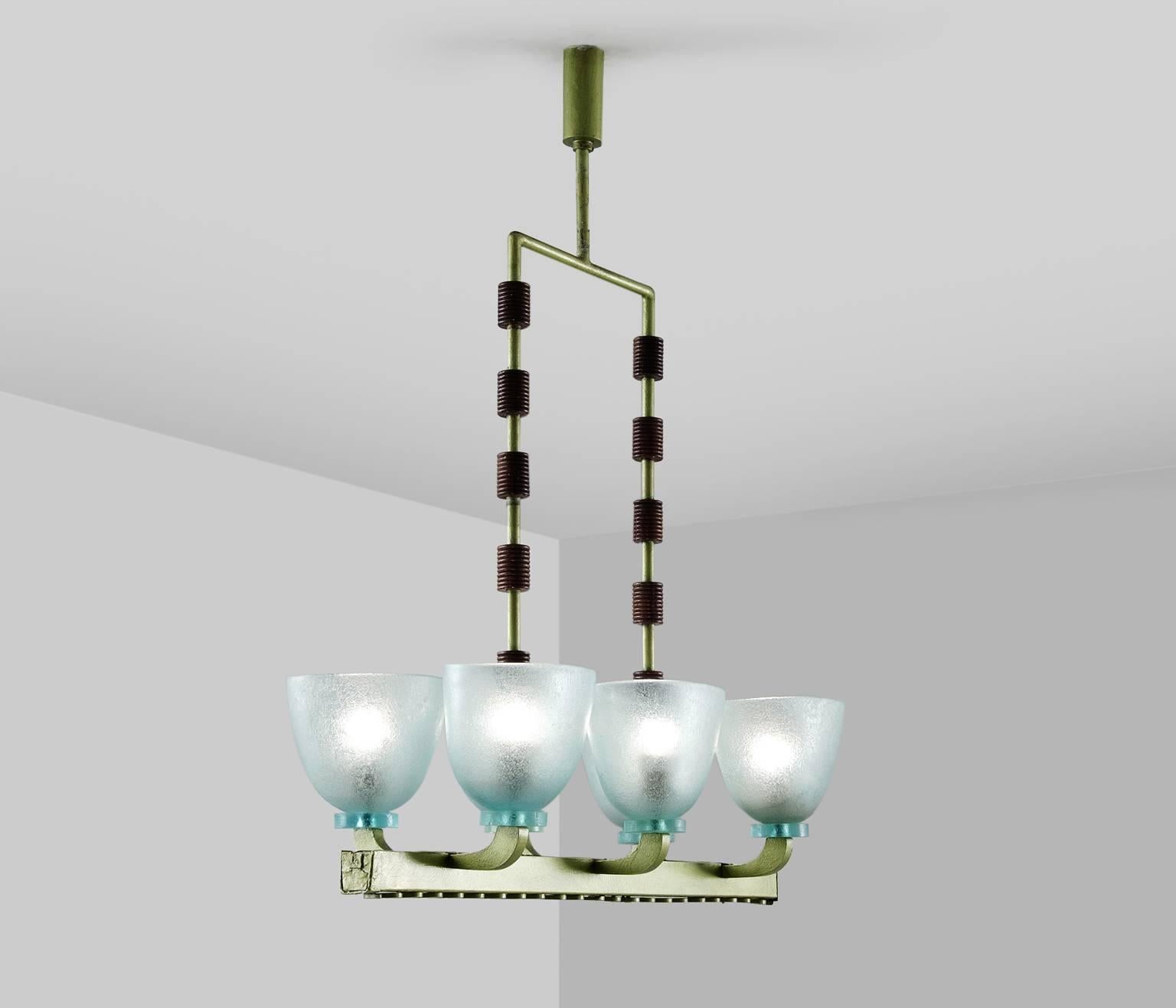 Chandelier in Murano glass, wood and metal by Seguso, Italy, 1940s. 

Large Murano glass chandelier by Seguso. This wonderful chandelier has a soft green frame in metal, with wooden decorative cylinder shaped elements onto the vertical tubular