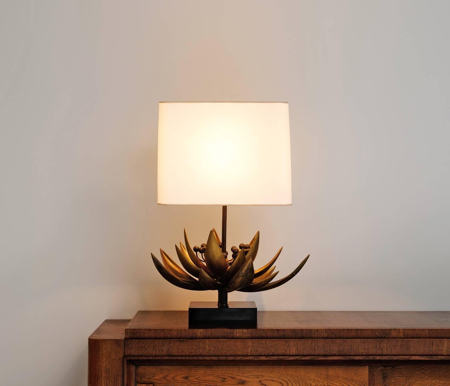 Floral table lamp in brass by Maison Jansen, France 1970s. 
Designed and signed by Christian Techoueyres. 

Table lamp with white shade. The stern of the lamp is decorated with a brass flower. The brass makes a nice contrast to the stone base.