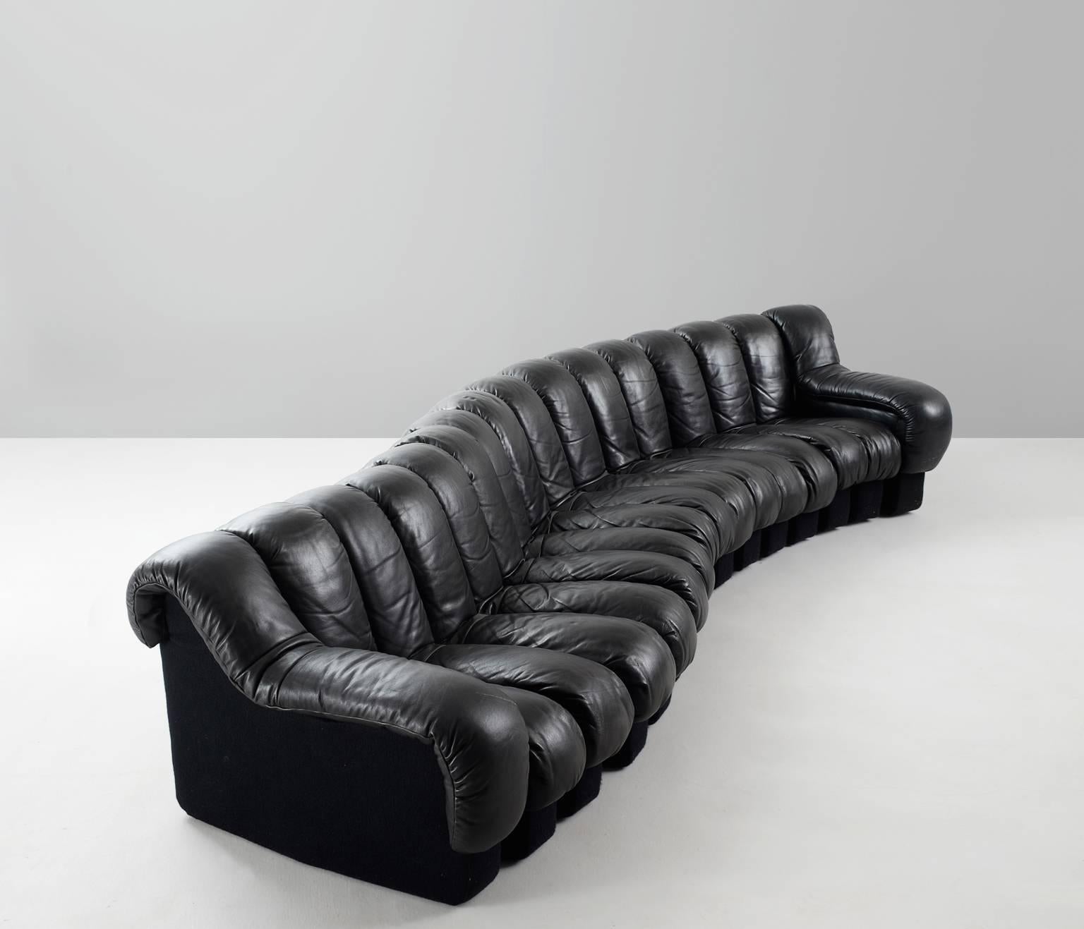 De Sede ‘Snake’ DS-600, black leather and felt, Switzerland, 1972. 

De Sede 'Non Stop' sectional sofa containing 16 pieces in original black leather and black felt back. 14 centerpieces and two armrests. 

A design by Ueli Berger, Elenora