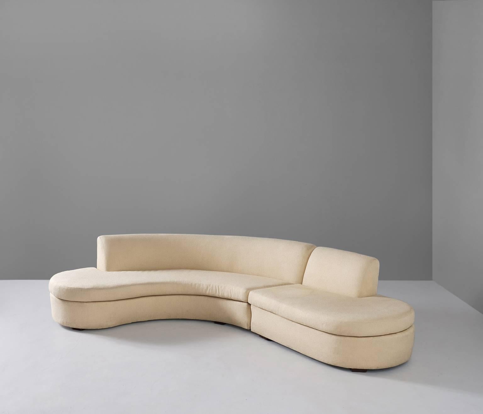 Free-form sofa, fabric, Europe, 1970s.

Organic shaped sectional sofa. The sofa consist of two elements. The backrest nicely follows the curve of the seating. This serpentine sofa has beautiful round edges. Additional line to the seating to create
