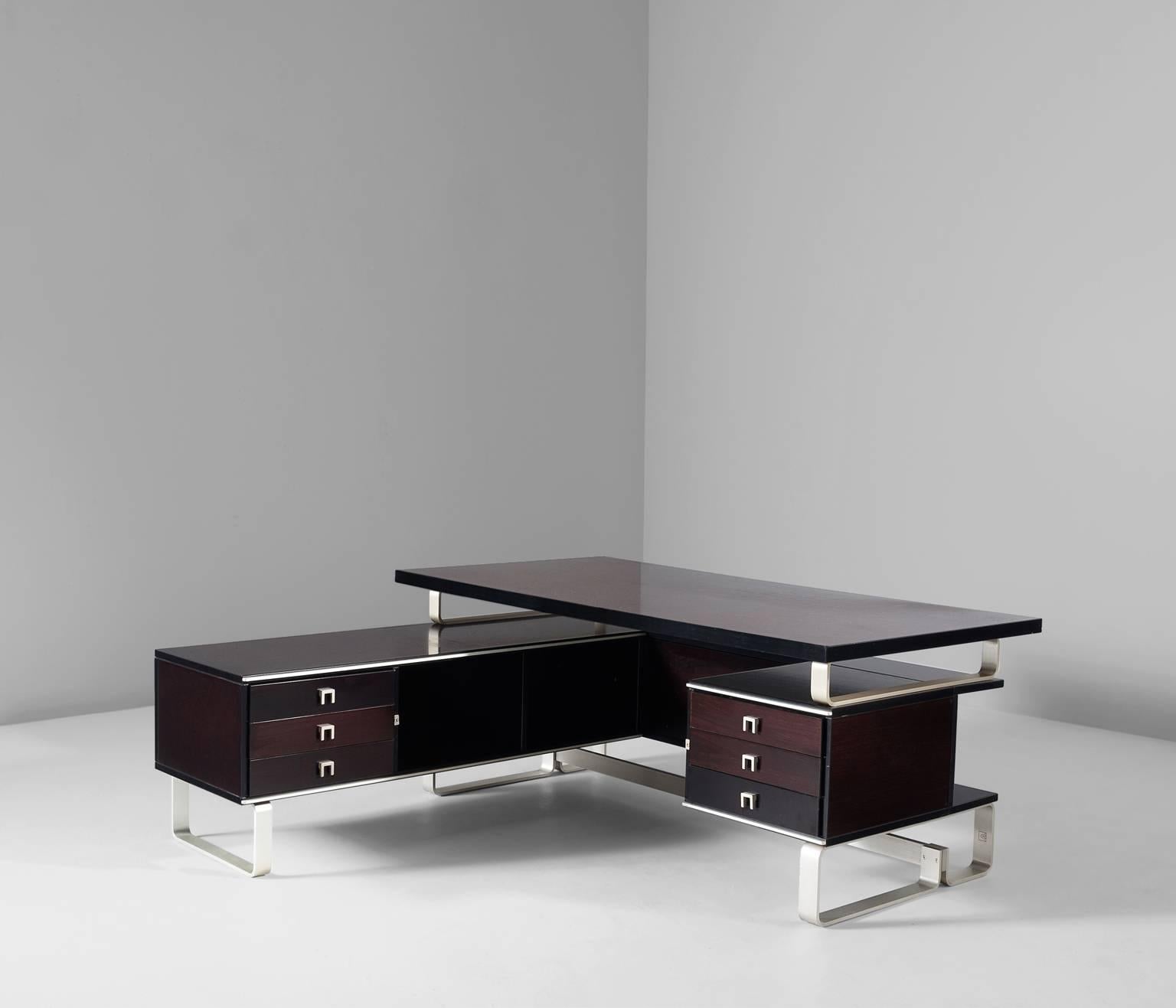 Desk with retour, in mahogany and aluminium, for Abbondinterni, Italy 1960s.

Large desk and return. Frame from aluminium strips. Both sides of the desks are equipped with three drawers. Rectangular table top. The mahogany is stained in a dark