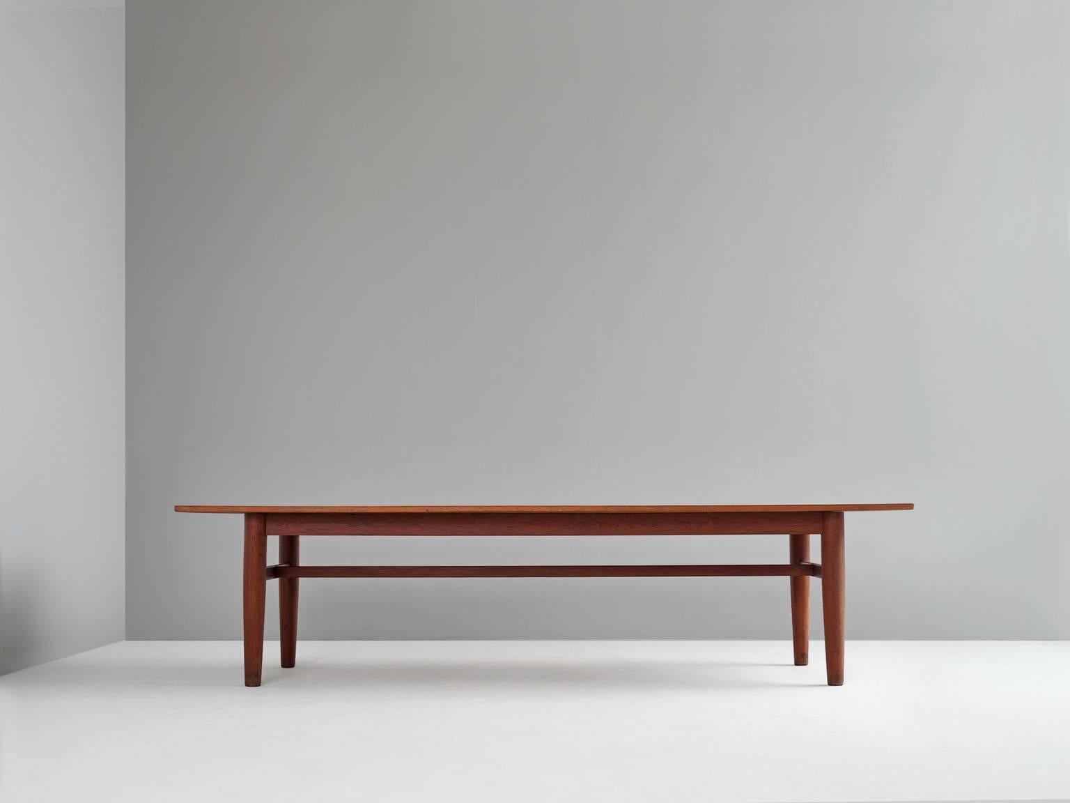 Dining/conference table, in teak, Scandinava 1950s. 

Large dining table in teak. Due the large top and great legs this table has a quite solid design. The cross-connections soothe the design. Slightly curved top which gives this table more