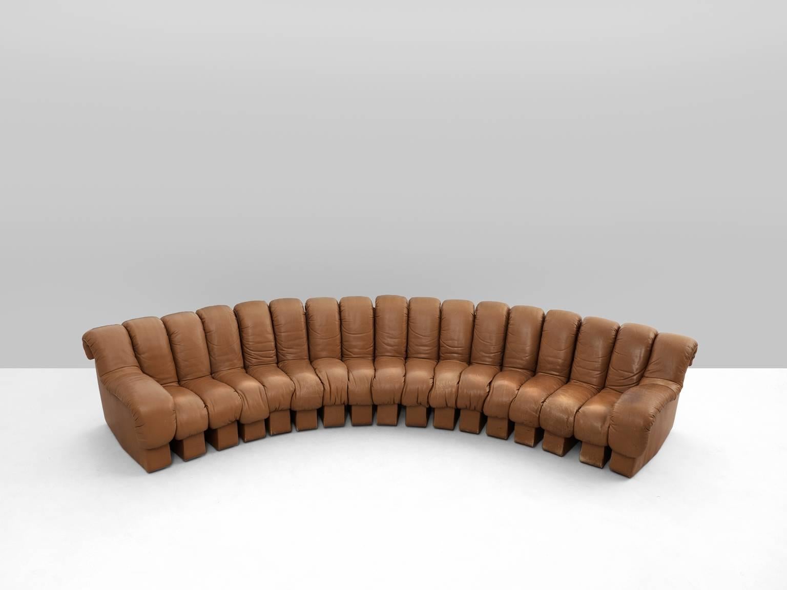 De Sede ‘Snake’ DS-600, in leather, Switzerland, 1972. 

DeSede 'Non Stop' sectional sofa containing 17 pieces in original cognac leather. 15 center pieces and two armrests. Any number of pieces can be zipped together ensuring an endless shape