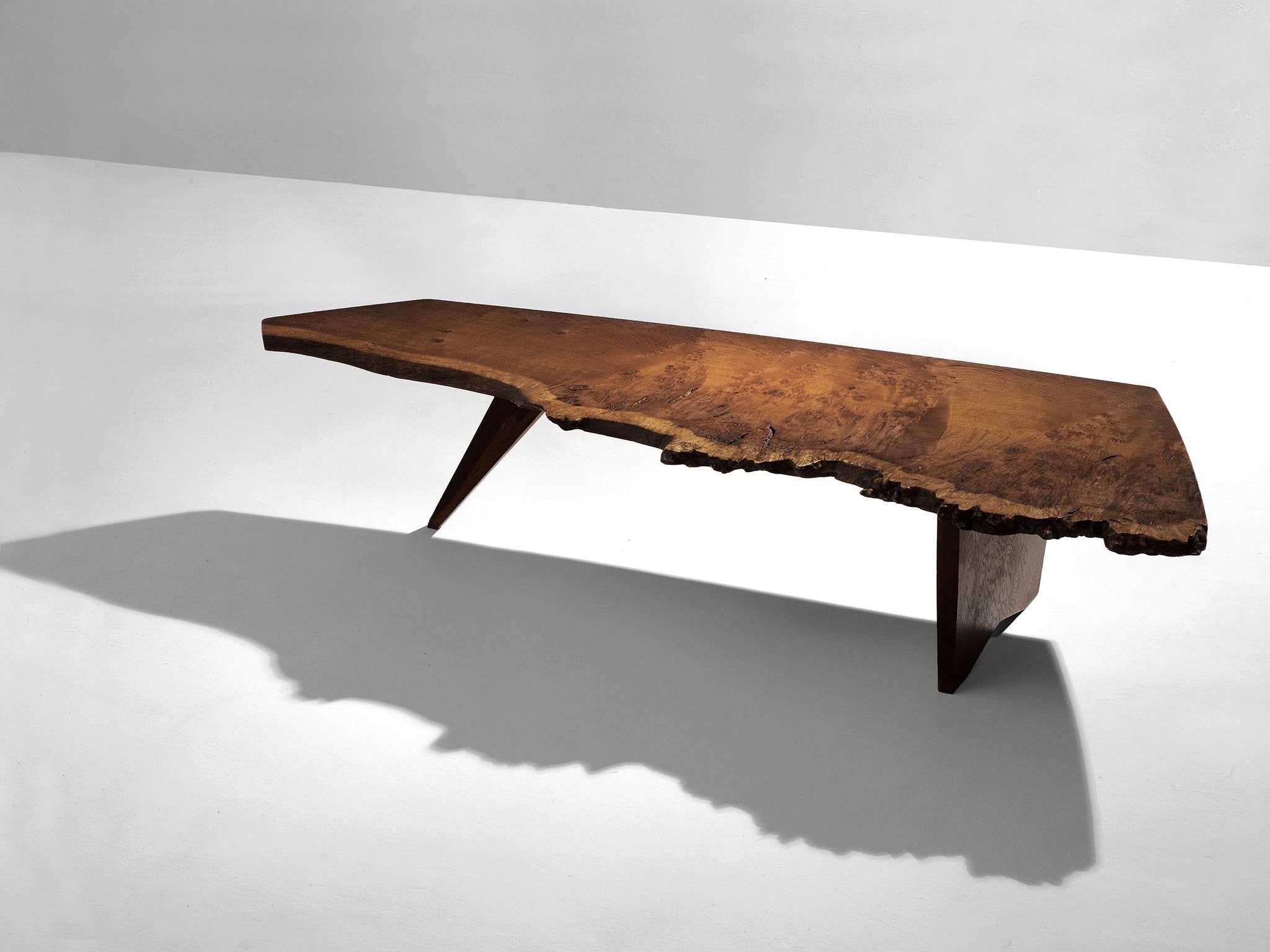 Coffee table, in oak, by George Nakashima, United States, 1950s. 

Exceptional coffee table by master woodworker George Nakasima. The table top is made from a slab of oak. Special detail is that it's from the root of the tree, which makes the