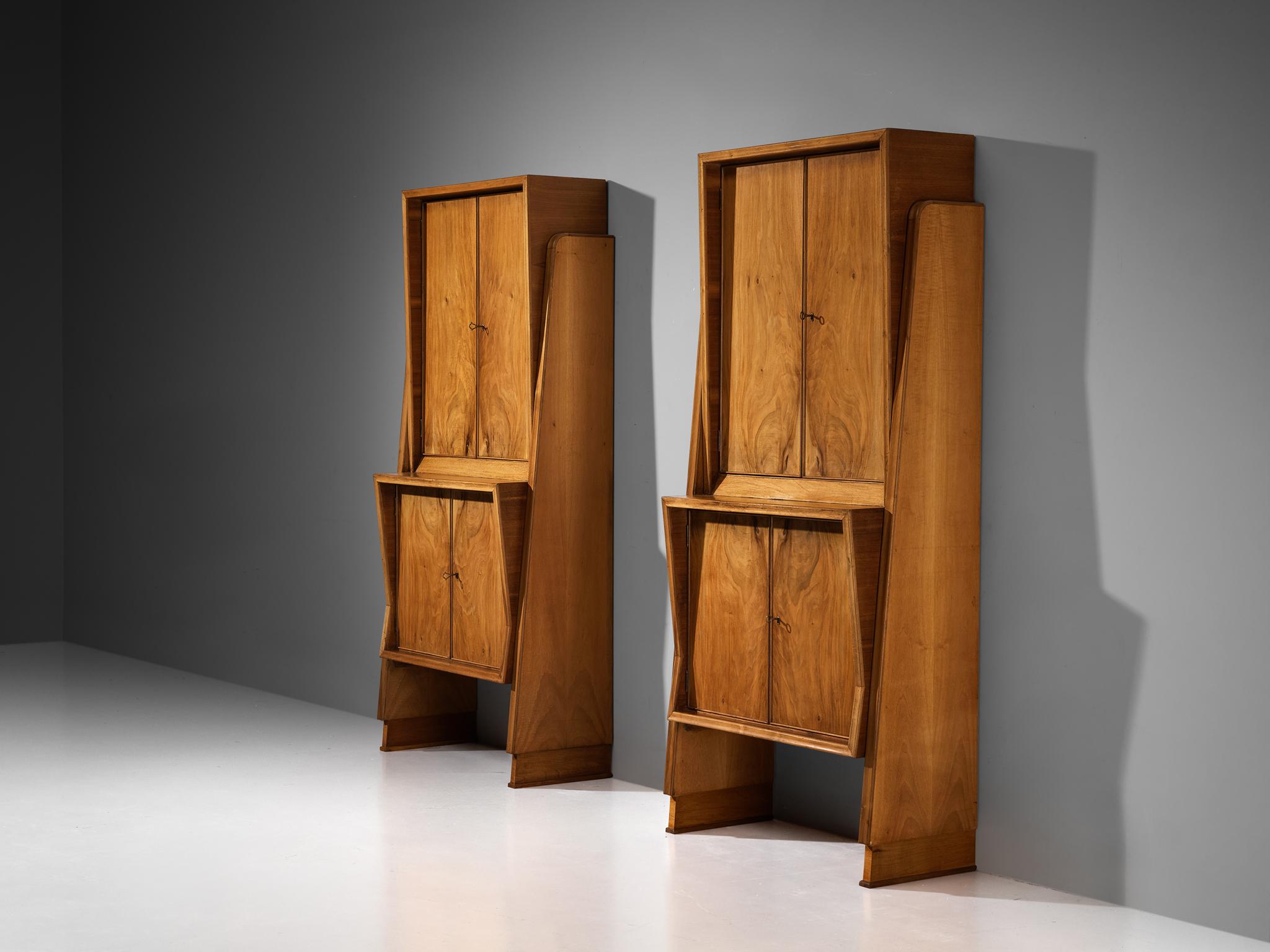 Highboards or cabinets, mahogany, Italy, 1940s

These striking Italian cabinets from the 1940s are a masterful blend geometry and craftsmanship. Constructed from rich mahogany, they showcase impeccable proportions and a stunning wood pattern that