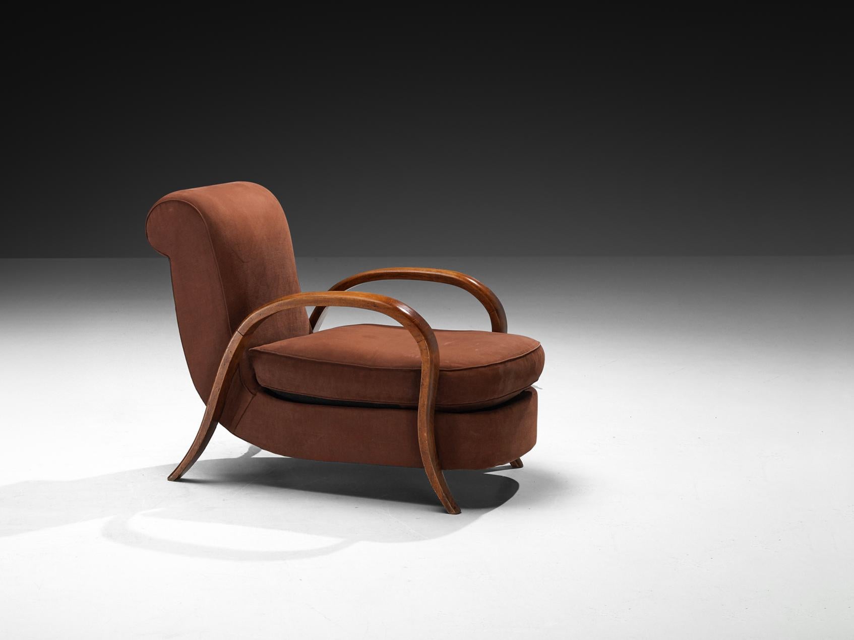 Lounge chair, beech, fabric, France, 1940s

A lovely French lounge chair from the late Art Deco period, showcasing elegant, rounded shapes and distinctive design elements. The armrests feature gracefully arched wood, enhancing their refined