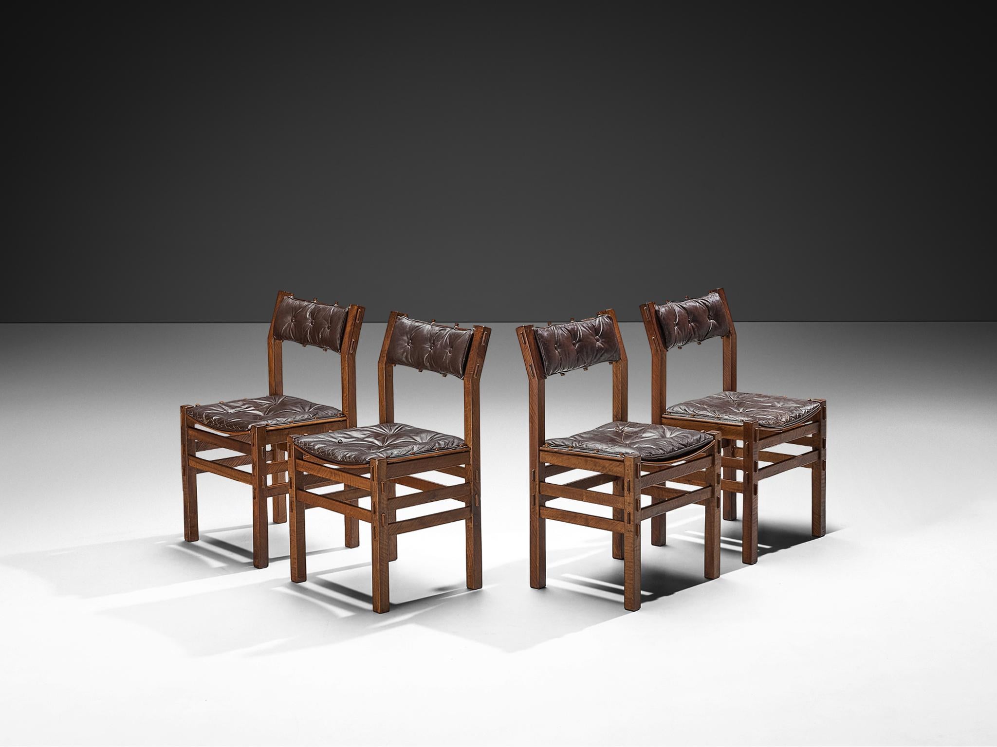 Giuseppe Rivadossi for Officina Rivadossi, set of four dining chairs, walnut, leather, Italy, 1970s

An exceptional design by the Italian sculptor and designer Giuseppe Rivadossi, featuring a high level of craftsmanship in woodwork. These chairs are