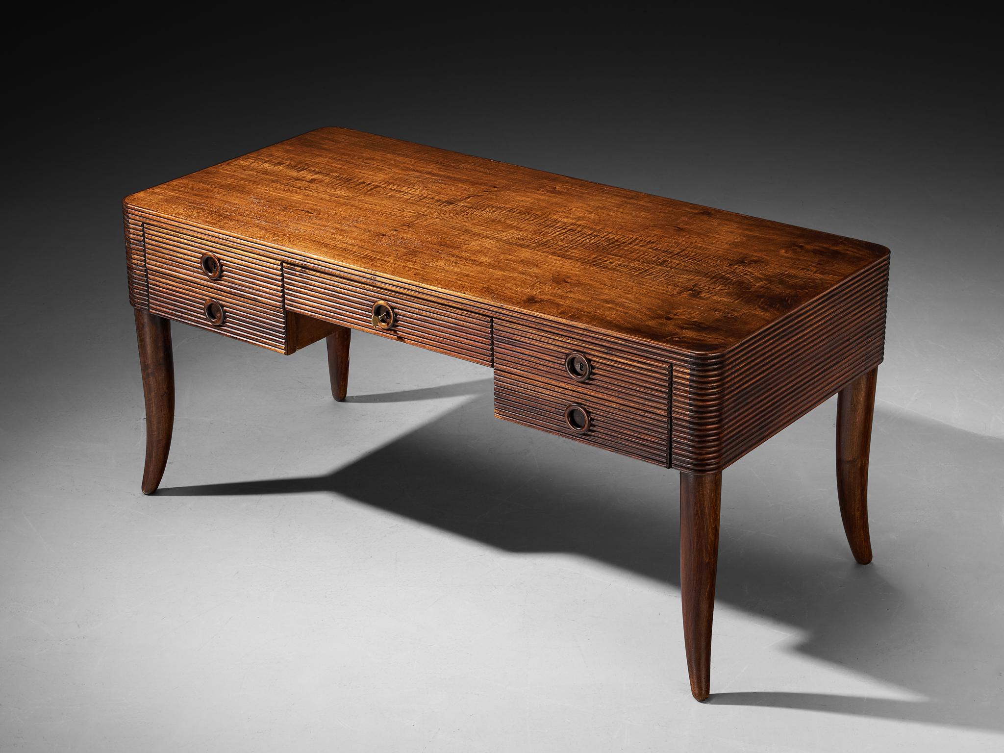 Paolo Buffa for Galdino Maspero, writing desk, walnut, Italy, late 1930s/early 1940s

This writing desk, designed by Paolo Buffa and meticulously crafted by Galdino Maspero in the late 1930s or early 1940s, is a powerful example of the designer’s