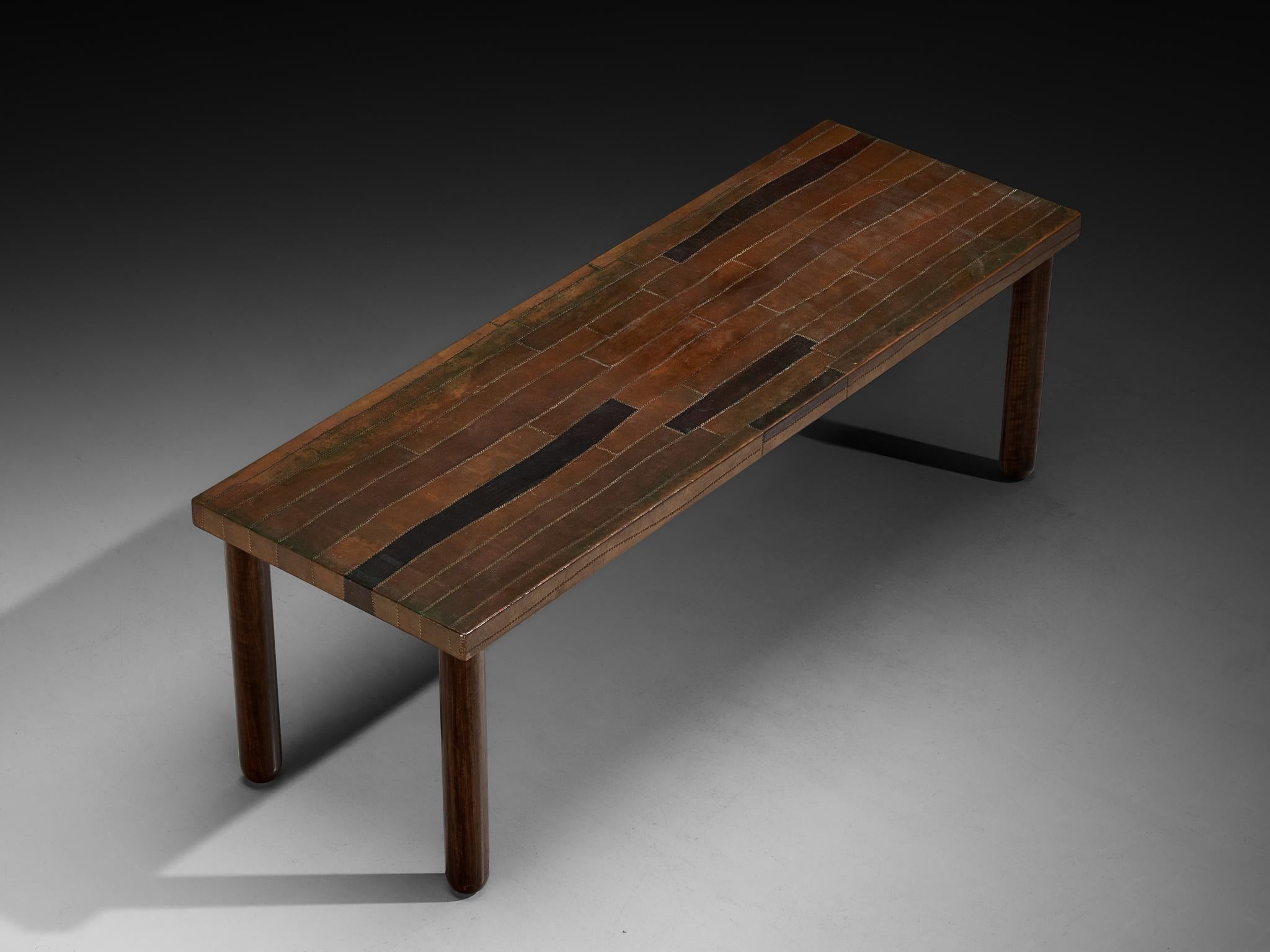 Lorenzo Burchiellaro, dining table, copper, stained beech, Italy, 1960s

This dining table, crafted in the 1960s by Italian designer and sculptor Lorenzo Burchiellaro (1933-2017), stands as a magnificent creation. The copper showcases a beautiful,