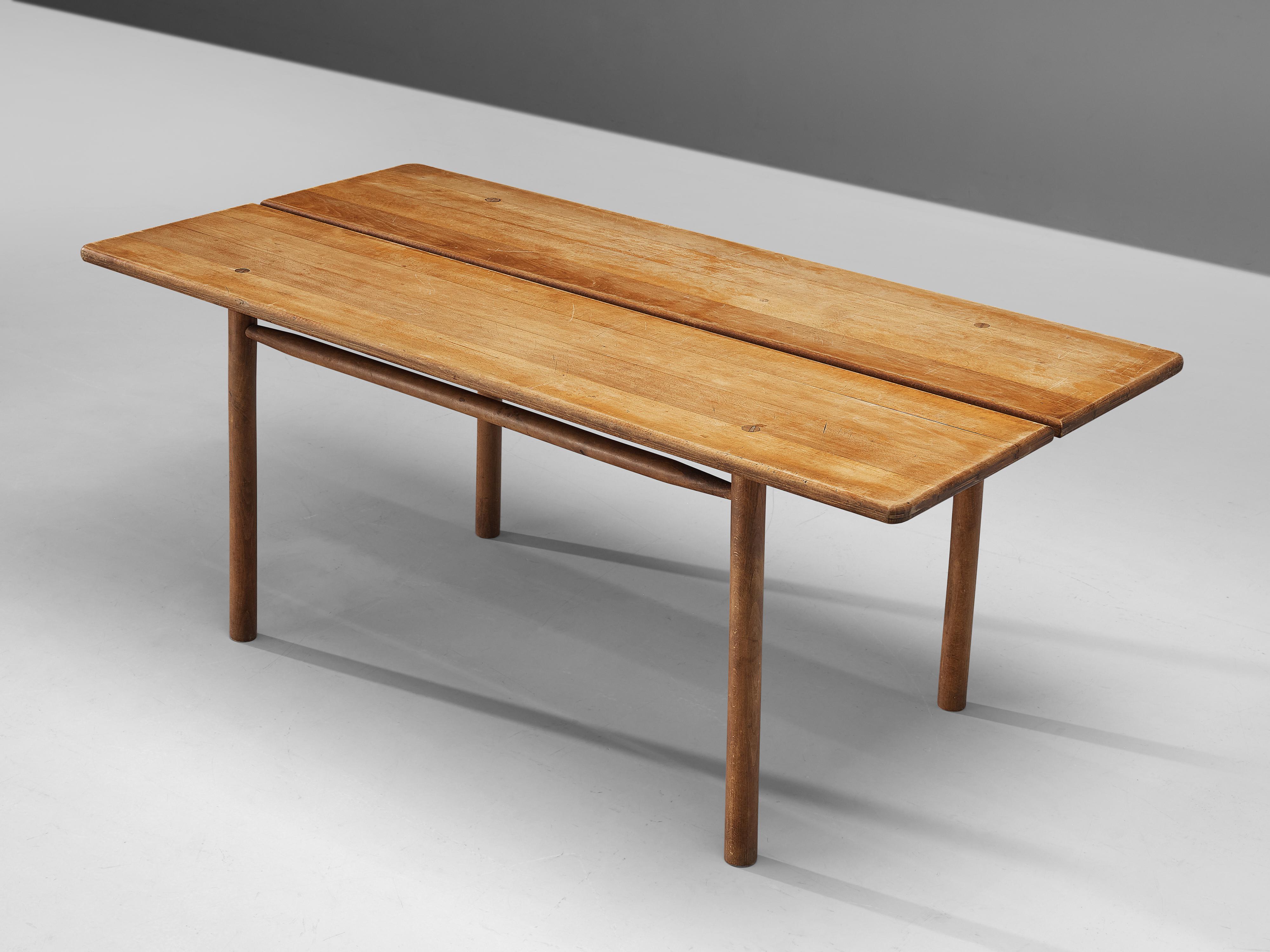 Pierre Gautier-Delaye, dining table, solid beech, France, 1950s

This French dining table, designed by Pierre Gautier-Delaye, is executed in beechwood and features a beautifully patinated surface that speaks to its age and character. The tabletop is