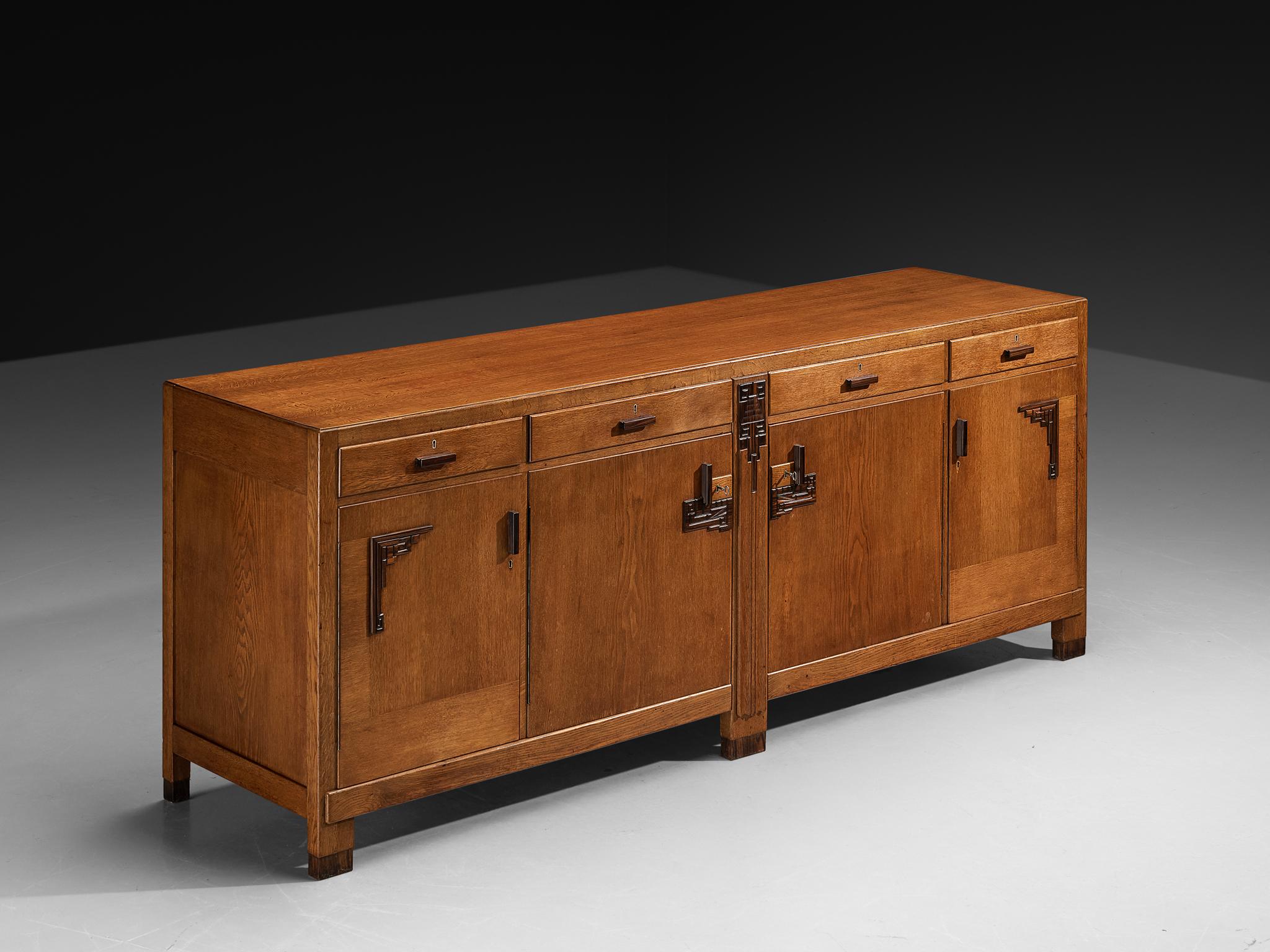 Sideboard, oak, coromandel, the Netherlands, 1930s

This sideboard, dating from the 1930s and originating from the Netherlands, is a distinctive example of the Amsterdamse School movement, executed in oak with  coromandel details. The piece is