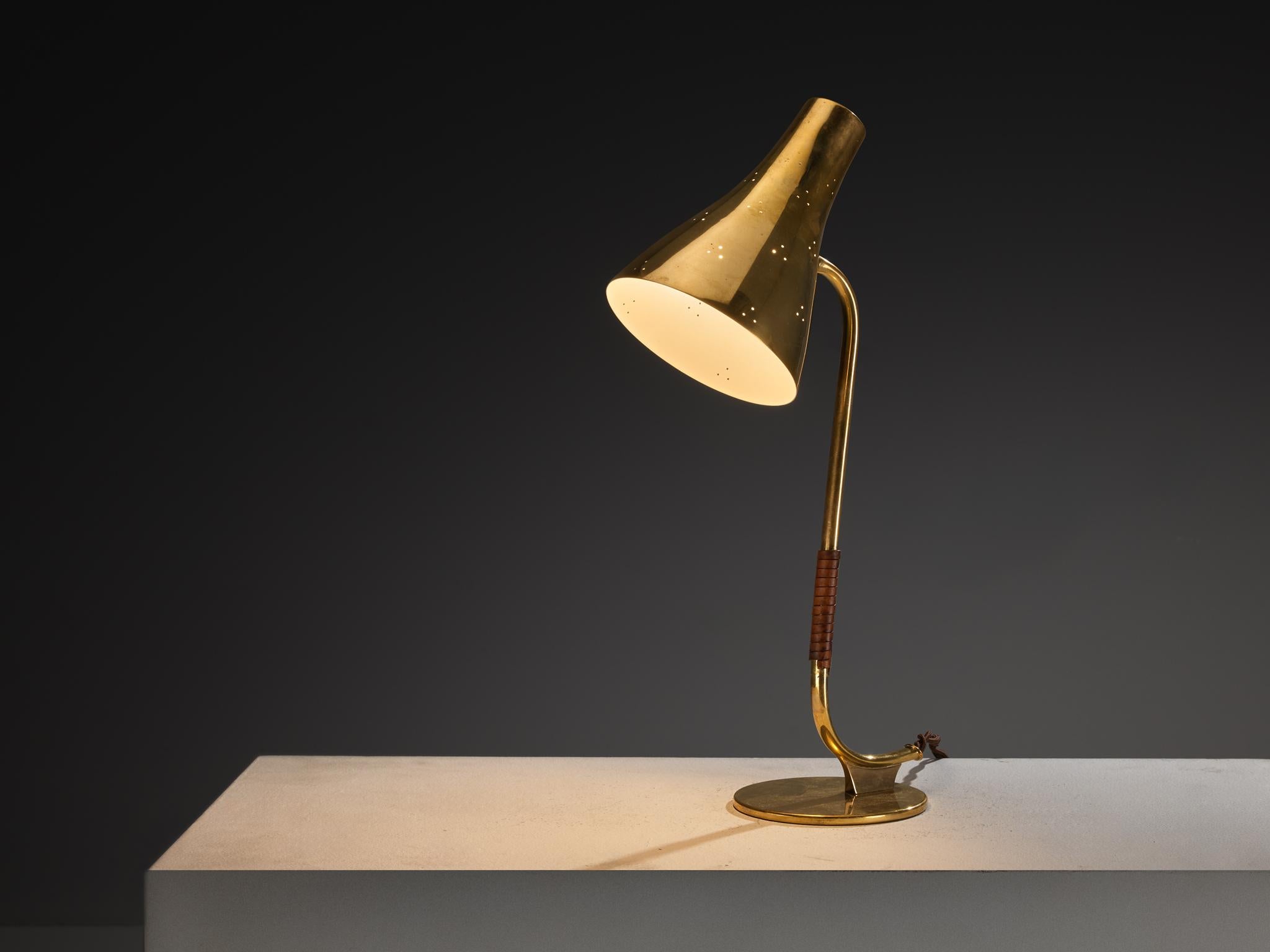 Paavo Tynell for Taito Oy, desk lamp, model '9212A', brass, leather, Finland, 1950s

Paavo Tynell was a pioneering Finnish designer who helped shape early 20th-century lighting in Finland. He belonged to the generation that, during the 1920s and