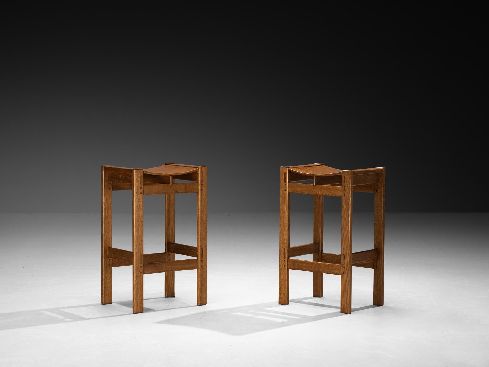 Giuseppe Rivadossi for Officina Rivadossi, pair of stools, oak, Italy, 1970s

These lovely stools are a design by Giuseppe Rivadossi. The material used to make these stools is oak, which shows a striking grain pattern and warm tone. The stools