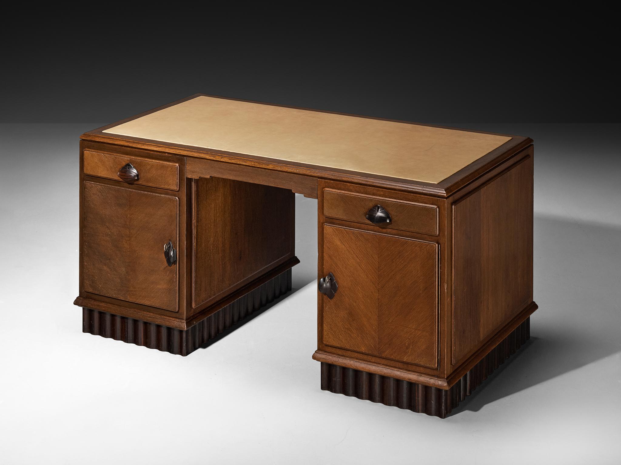 Desk, leather, coromandel, oak, Netherlands, 1920s

This distinctive desk was crafted in the Netherlands during the 1920s and exemplifies the Amsterdamse School movement. Made from oak with rich coromandel wood detailing, it showcases the movement’s