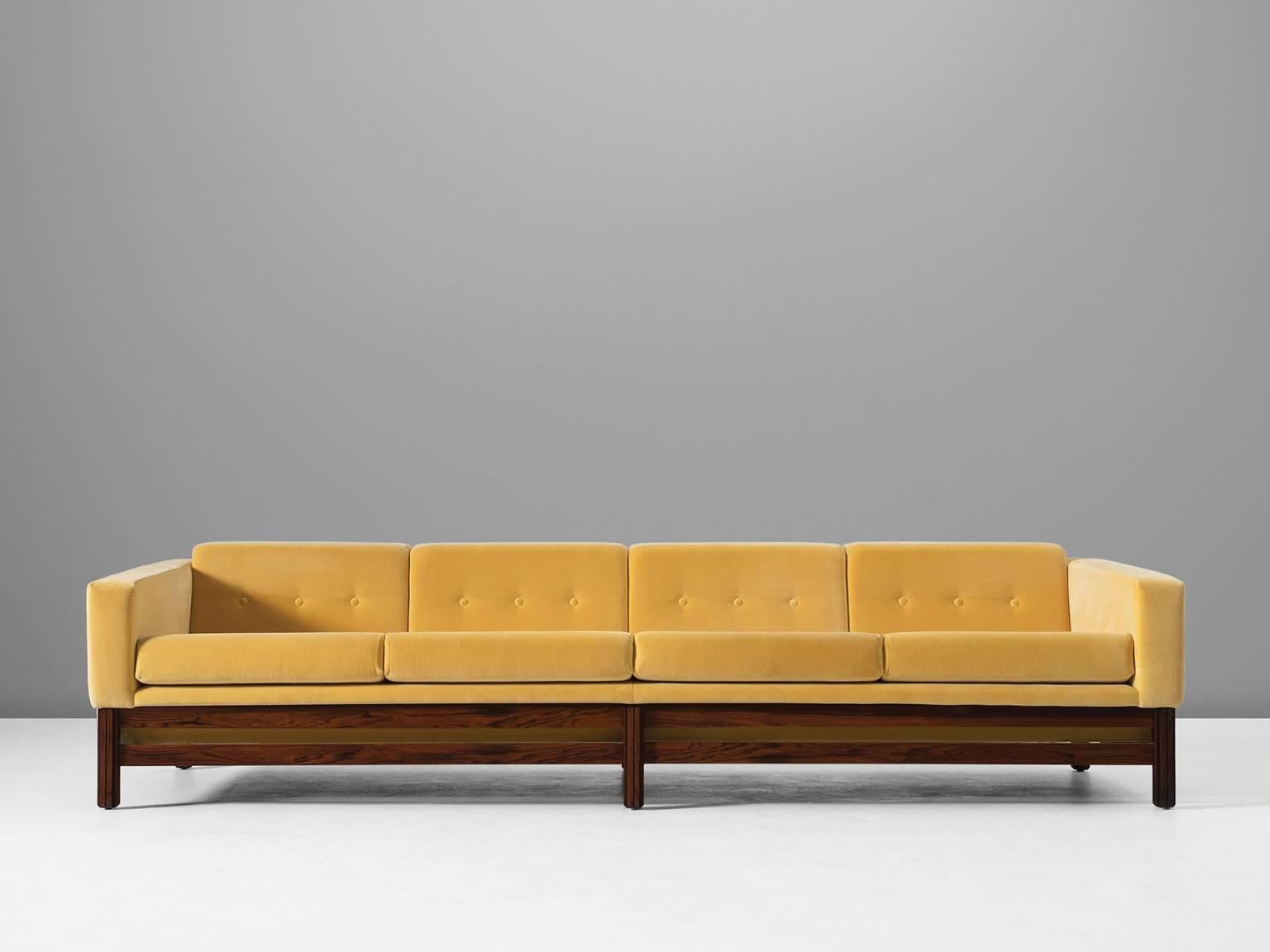 Sofa, in rosewood and fabric by Saporiti, Italy 1960s.

This sofa, equipped with a solid rosewood frame is reupholstered in high quality yellow velours like fabric. Done by our own team of specialists of the in-house atelier of Morentz. The sofa