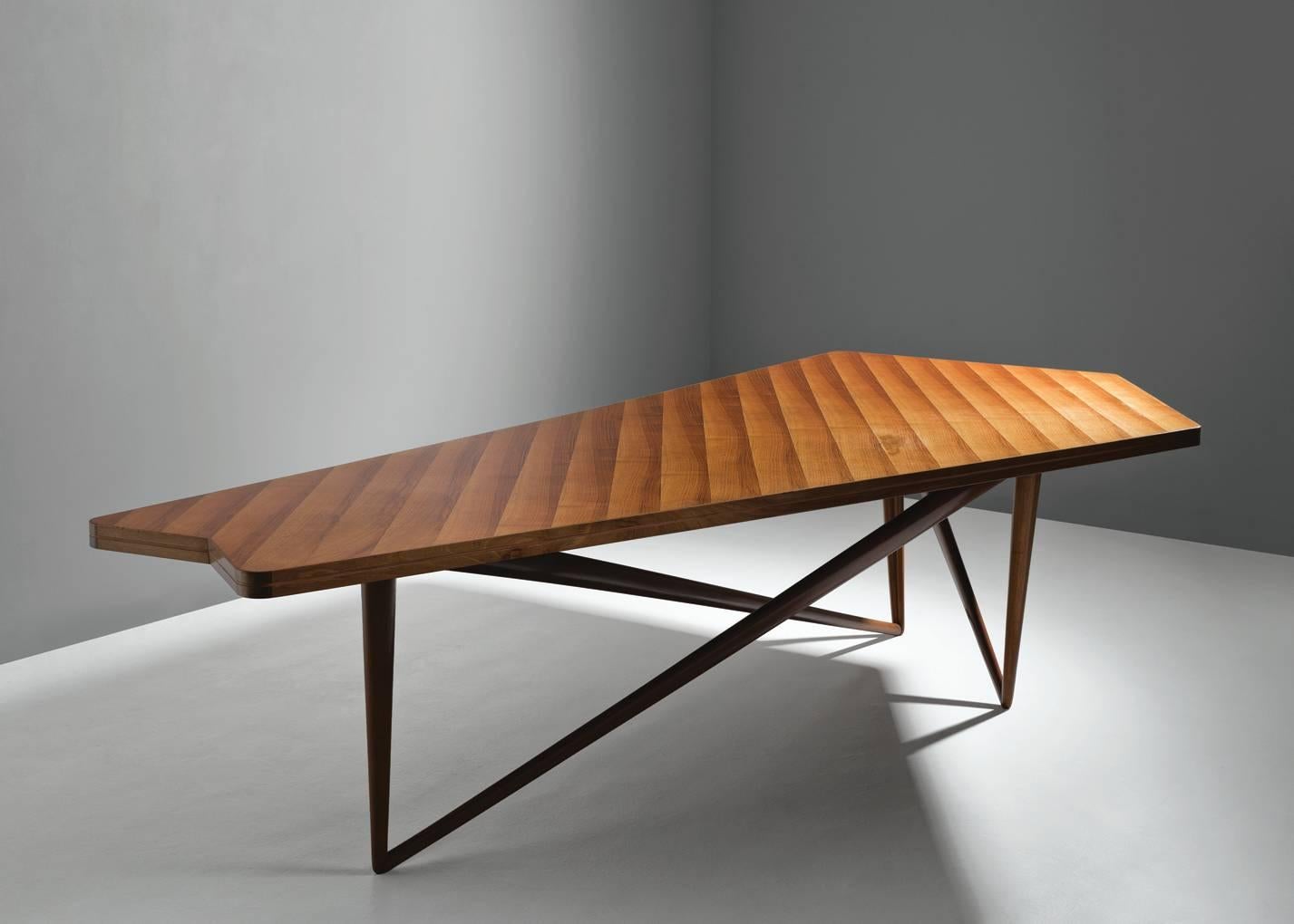Table, in walnut, by Pierluigi Giordani for Falegnameria di Bologna, Italy, circa 1953.

Large a-symmetrical conference table in walnut by Italian designer Pierluigi Giordano. This table was specially made for the board of directors from an
