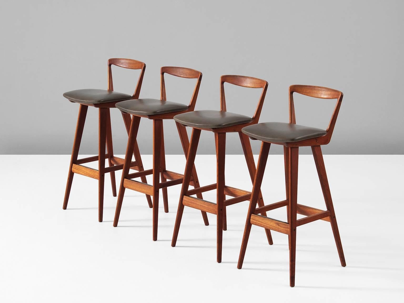 Set of four barstools model 43, in teak and fabric, by Henry Rosengren Hansen for Brande Møbelfabrik, Denmark, 1960. 

Highly detailed and excellent manufactured set of four bar stools. This set will easily match any kind of dry bar. The base