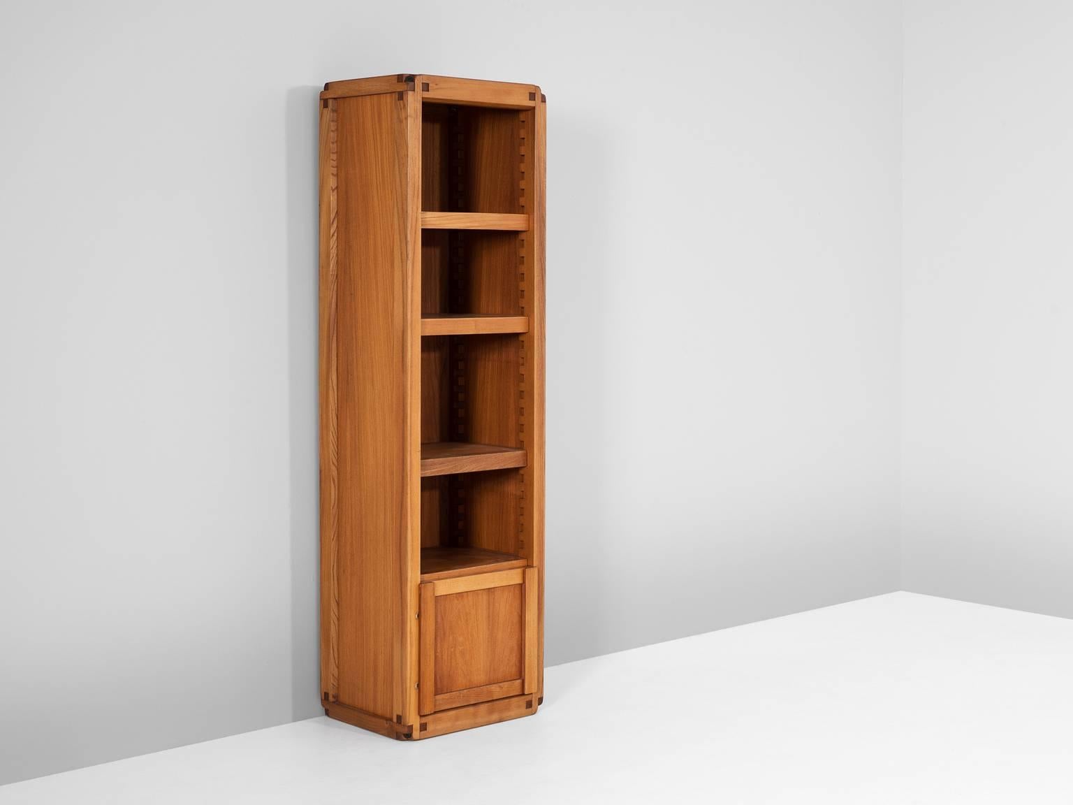 High cabinet, in solid elm, by Pierre Chapo, France, 1960s. 

Bookcase or high cabinet by French designer Pierre Chapo. This cabinet is equipped with three shelves and one storage part. Al shelves can be placed on desirable height. Executed in