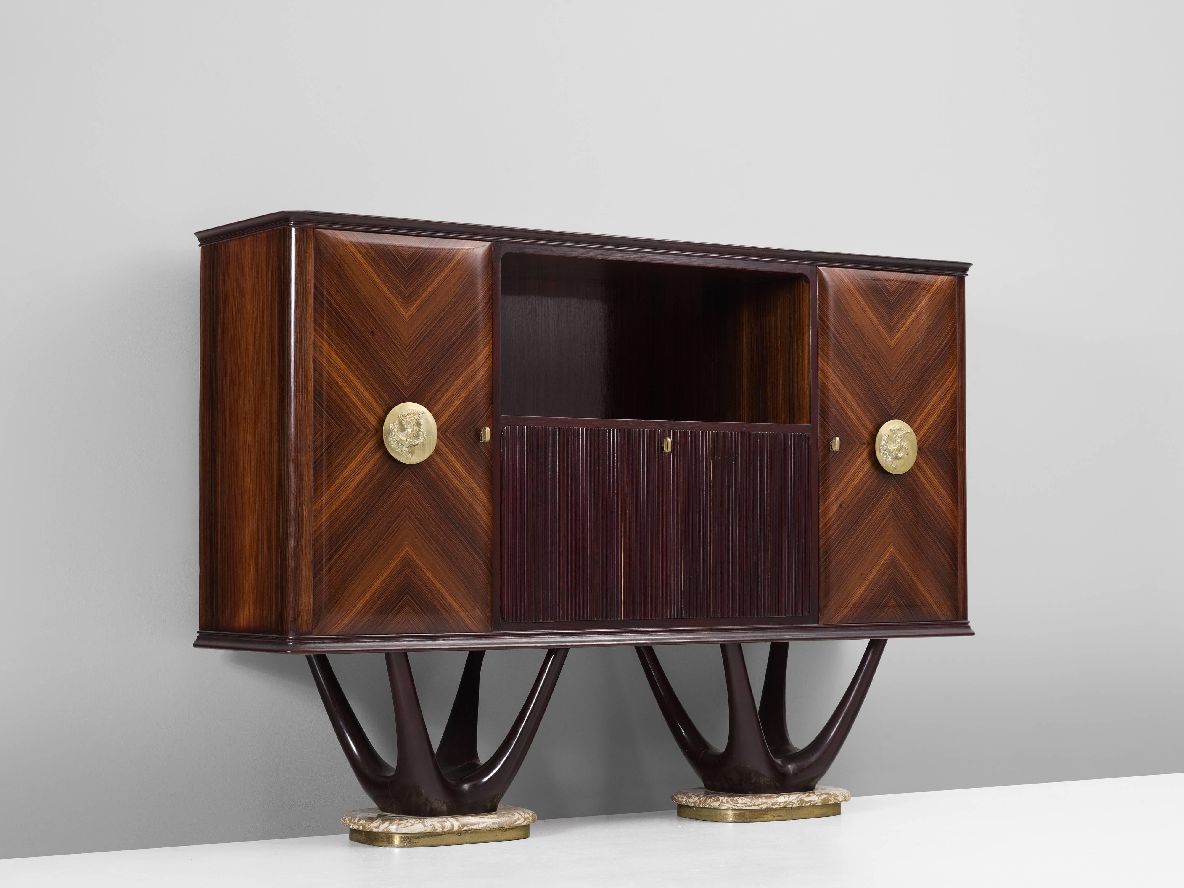 Cabinet in mahogany, maple, marble, glass and brass for Fratelli Turri, Italy 1950s.

Impressive bar in the style of Vittorio Dassi. The cabinet consist of a mahogany construction. The doors are made of rosewood veneer with a stunning graphical