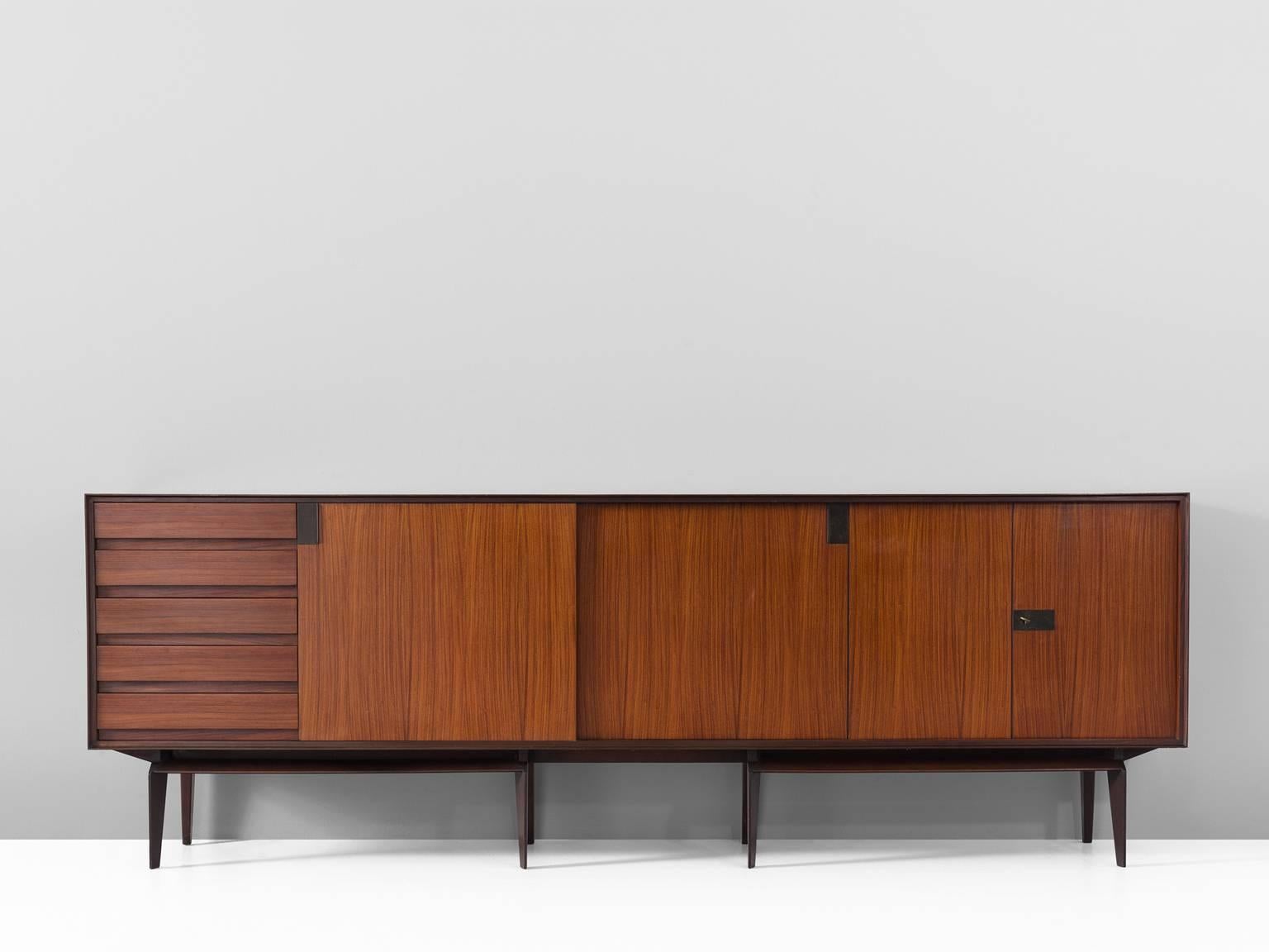 Sideboard, in rosewood and brass, by Vittorio Dassi for Palutari, Italy, 1950s. 

Highly rare large Italian sideboard by Vittorio Dassi. The credenza shows magnificent craftsmanship and well-designed proportions and details. Its length is quite
