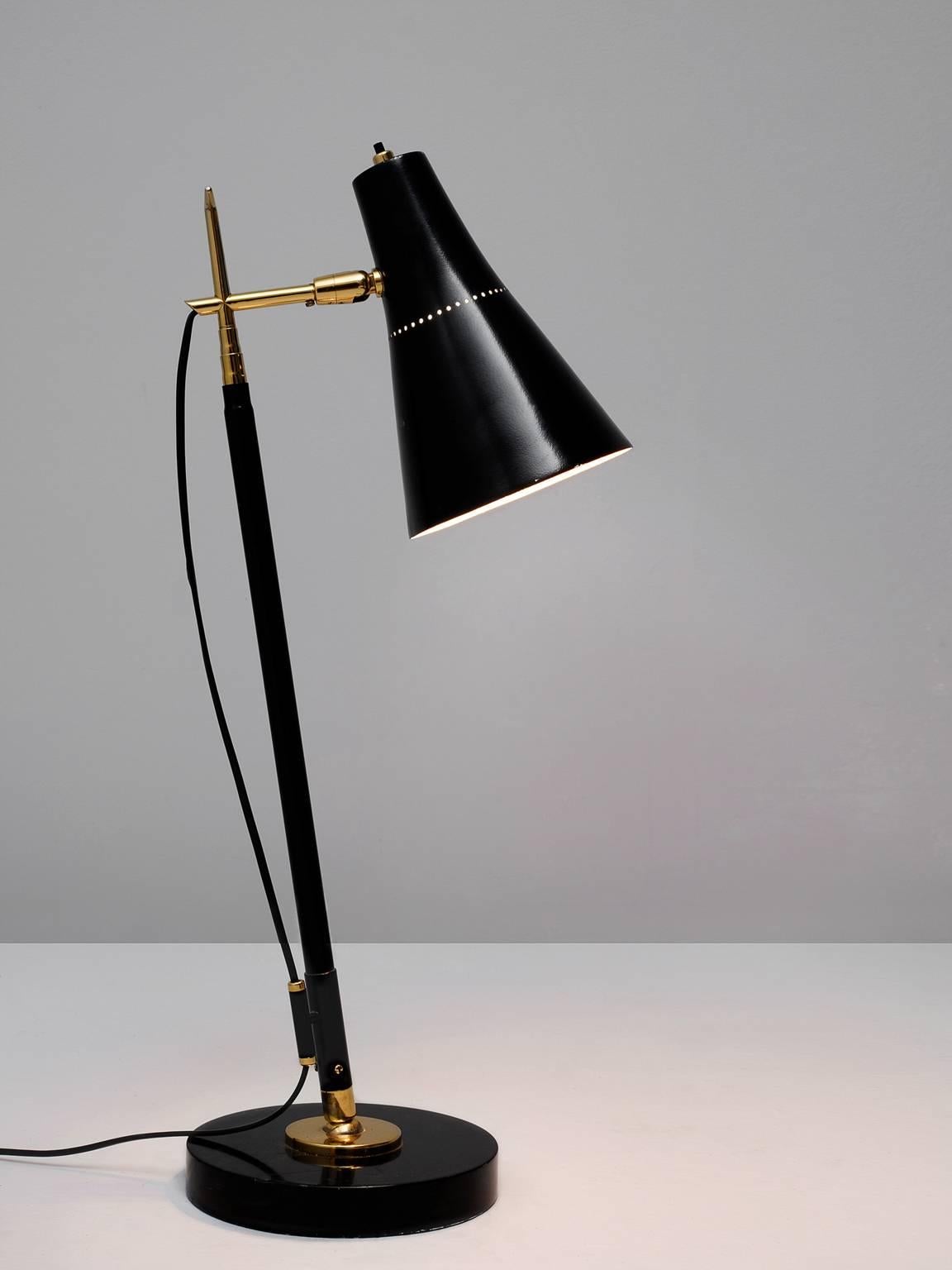 Adjustable floor lamp model 201 in metal, stone and brass, by Giuseppe Ostuni for O-Luce, Italy, 1951.

Exceptional light, which can be used as floor and table lamp. The black coated and brass stern is adjustable in height, from a total of 56cm to